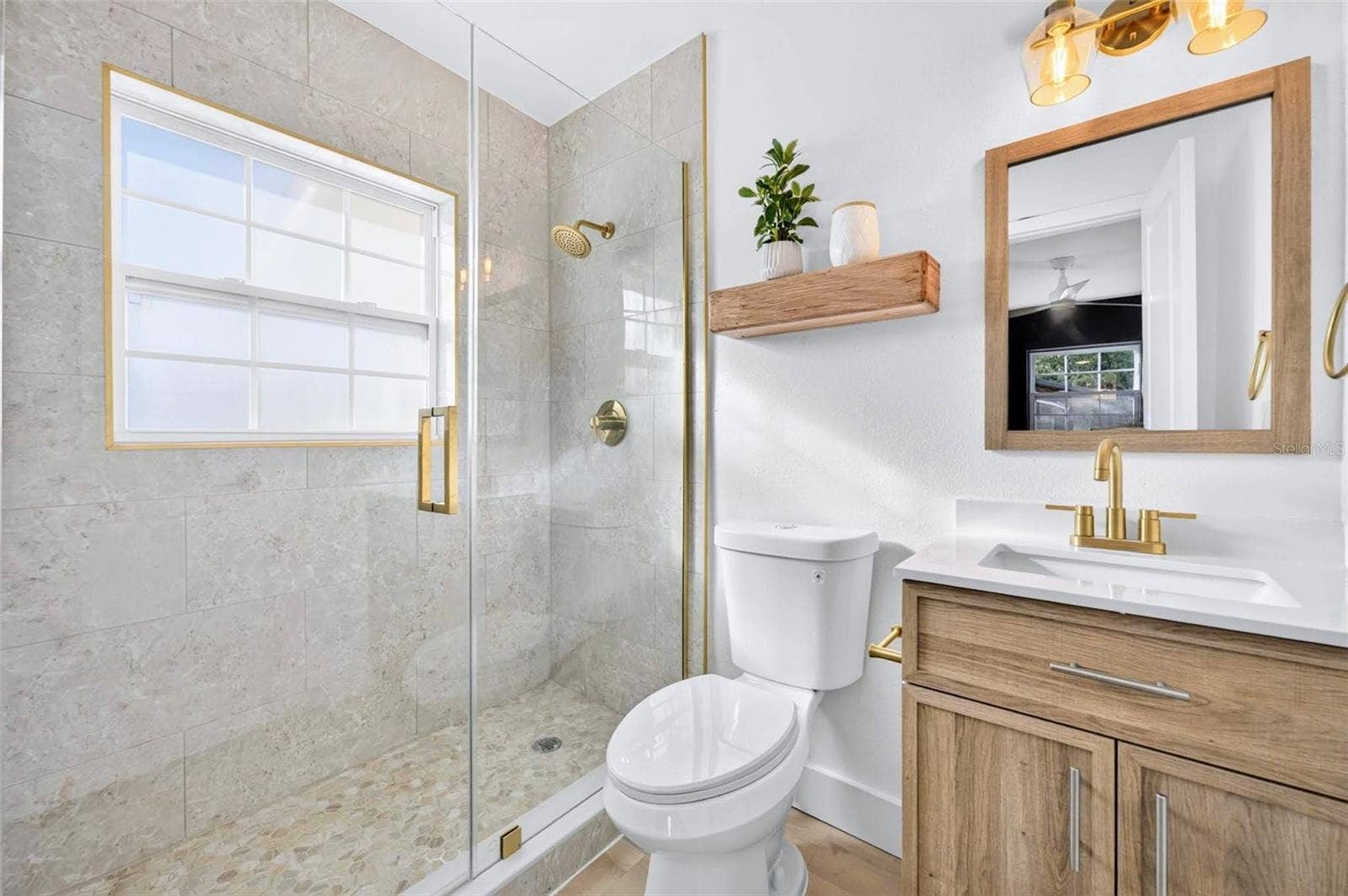 2168 RIDGE DRIVE, Winter Park, FL 32792 Primary Bathroom with updated tile and vanity for the new owners,