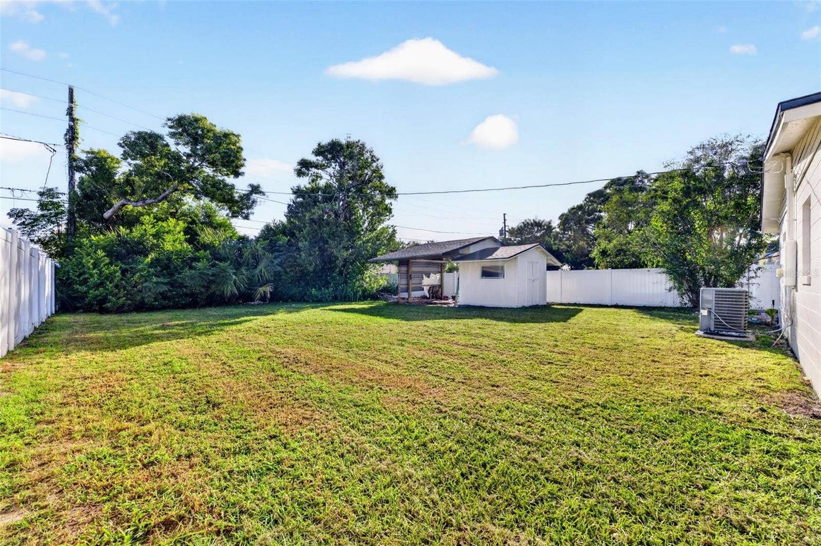 2168 RIDGE DRIVE, Winter Park, FL 32792 This backyard is huge and completely private with fencing all around it feels like having your own park back there,