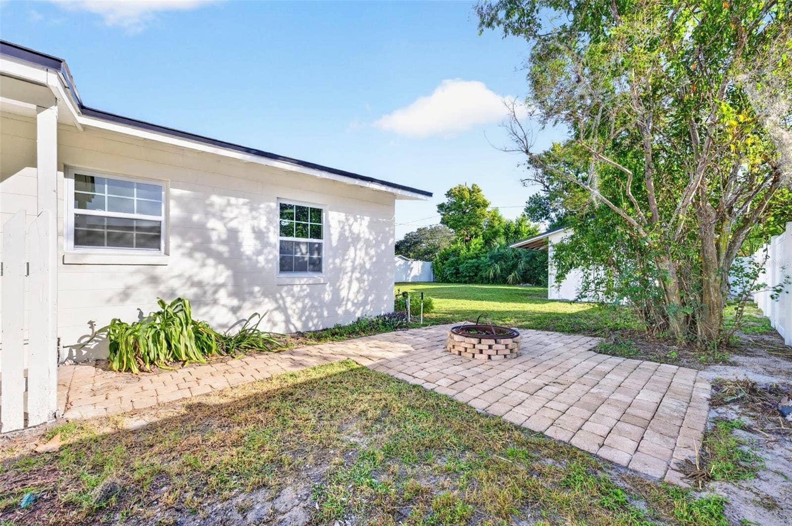 2168 RIDGE DRIVE, Winter Park, FL 32792 Right off the laundry room is the side lot with a fireplace to cozy up and relax after those stressful days.