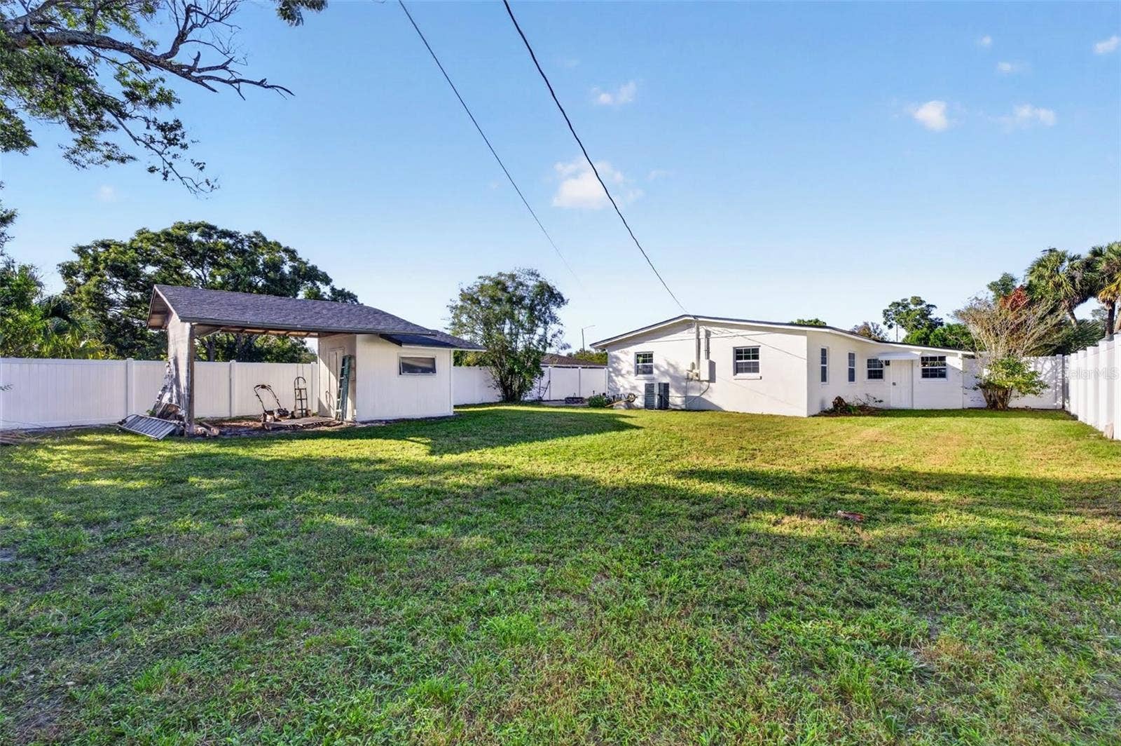 2168 RIDGE DRIVE, Winter Park, FL 32792 space behing the shed is also roofed off for more storage.