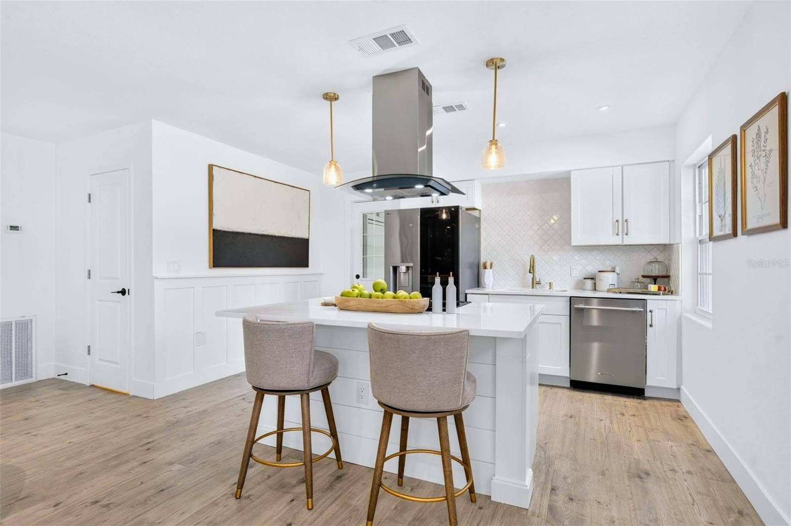 2168 RIDGE DRIVE, Winter Park, FL 32792 the Kitchen boasts a island stove with a vent hood and custom columns for the island ends.