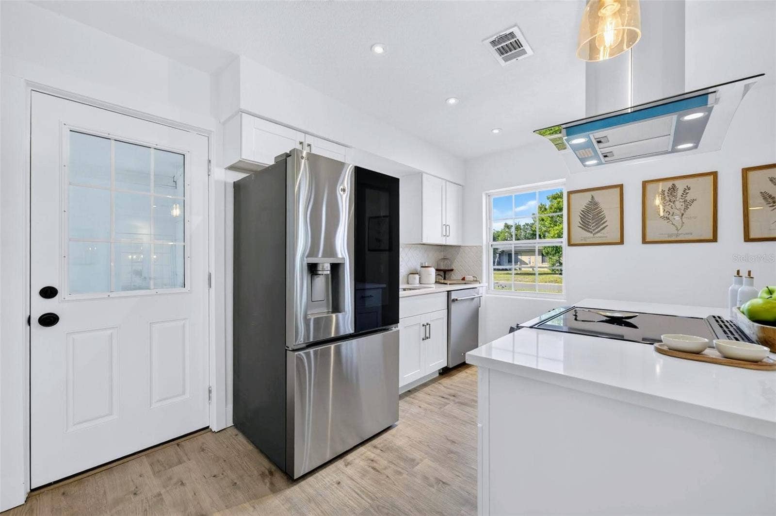 2168 RIDGE DRIVE, Winter Park, FL 32792 The High end fridge features a see through glass door with an ability to knock on the door to turn on the light of the fridge to see what is stored in the glass panel.