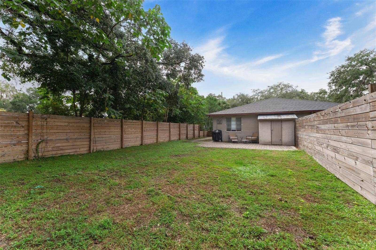 441 N FERN CREEK AVENUE, Orlando, FL 32803 Fenced back yard with patio & outside storage