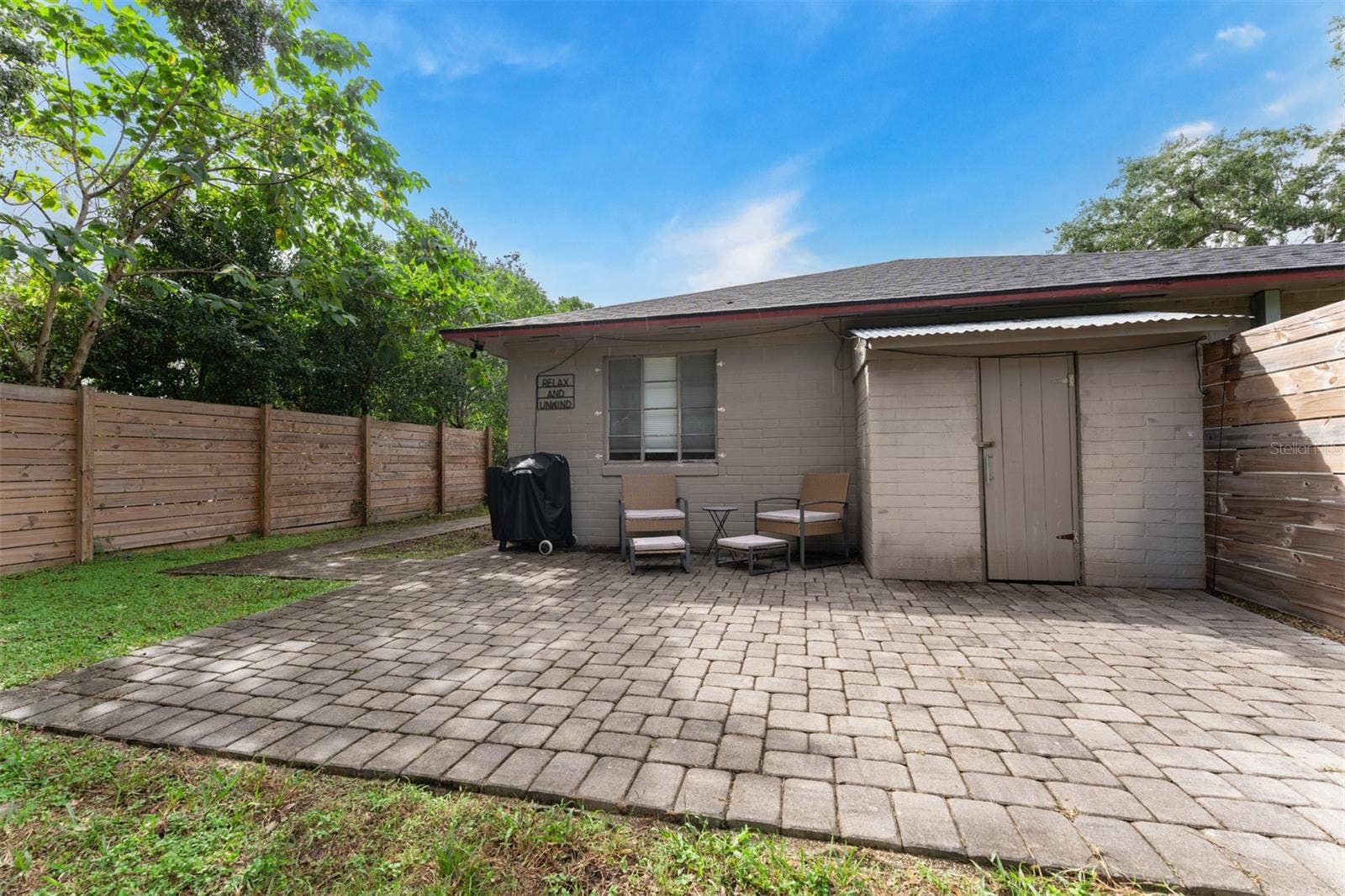 441 N FERN CREEK AVENUE, Orlando, FL 32803 Fenced back yard with patio & outside storage