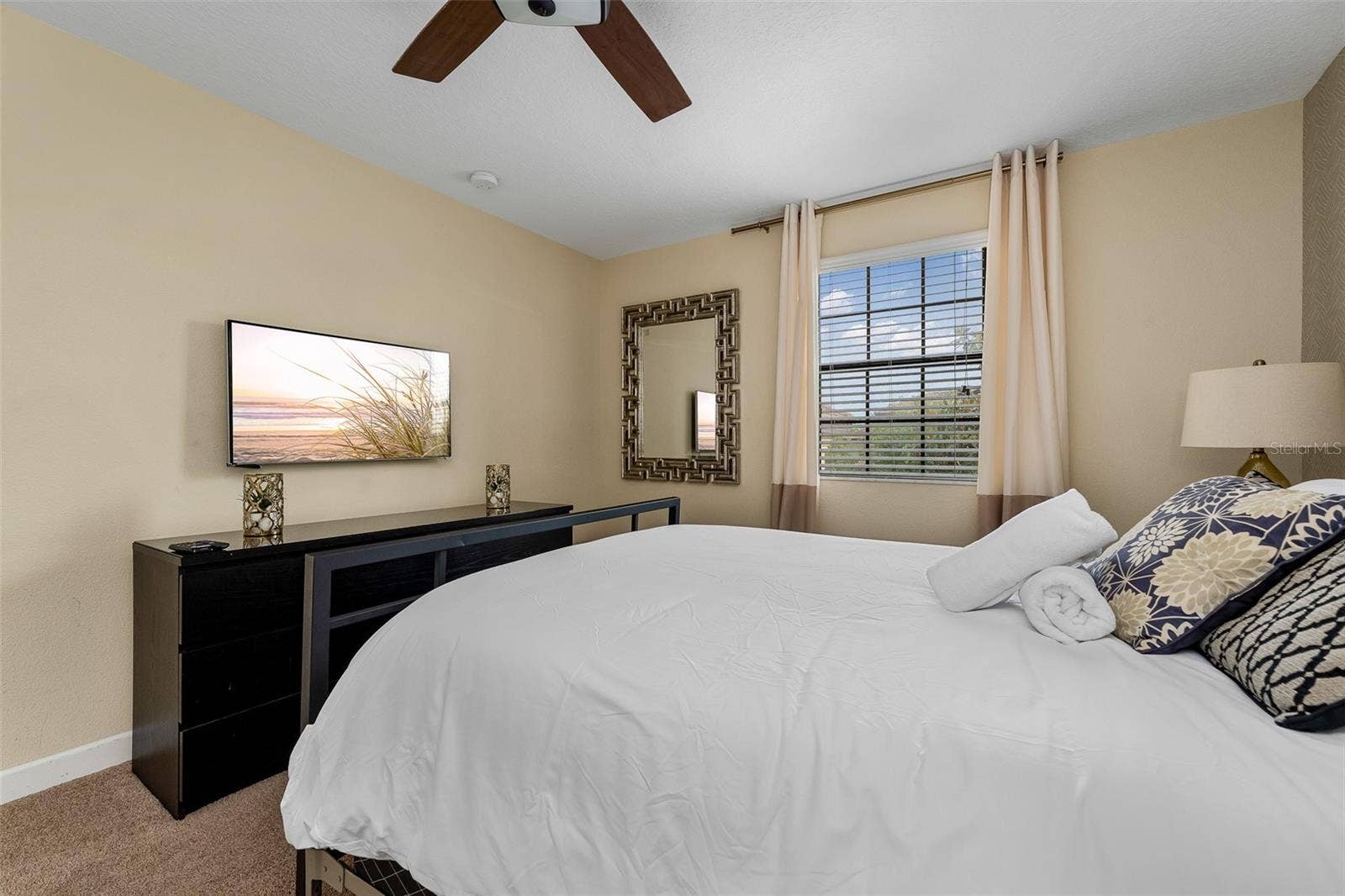 Additional View of the Upstairs Primary Suite with Comfortable Accommodations and Natural Light