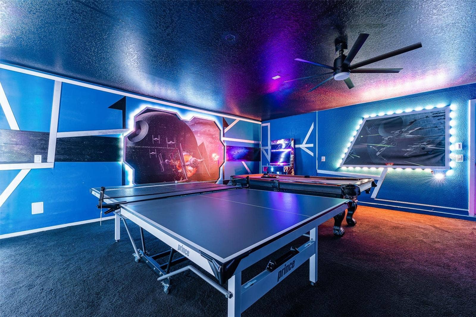 Let the Games Begin! Air-Conditioned Game Room Featuring Vibrant LED Lighting, Pool Table, Arcade Games and More