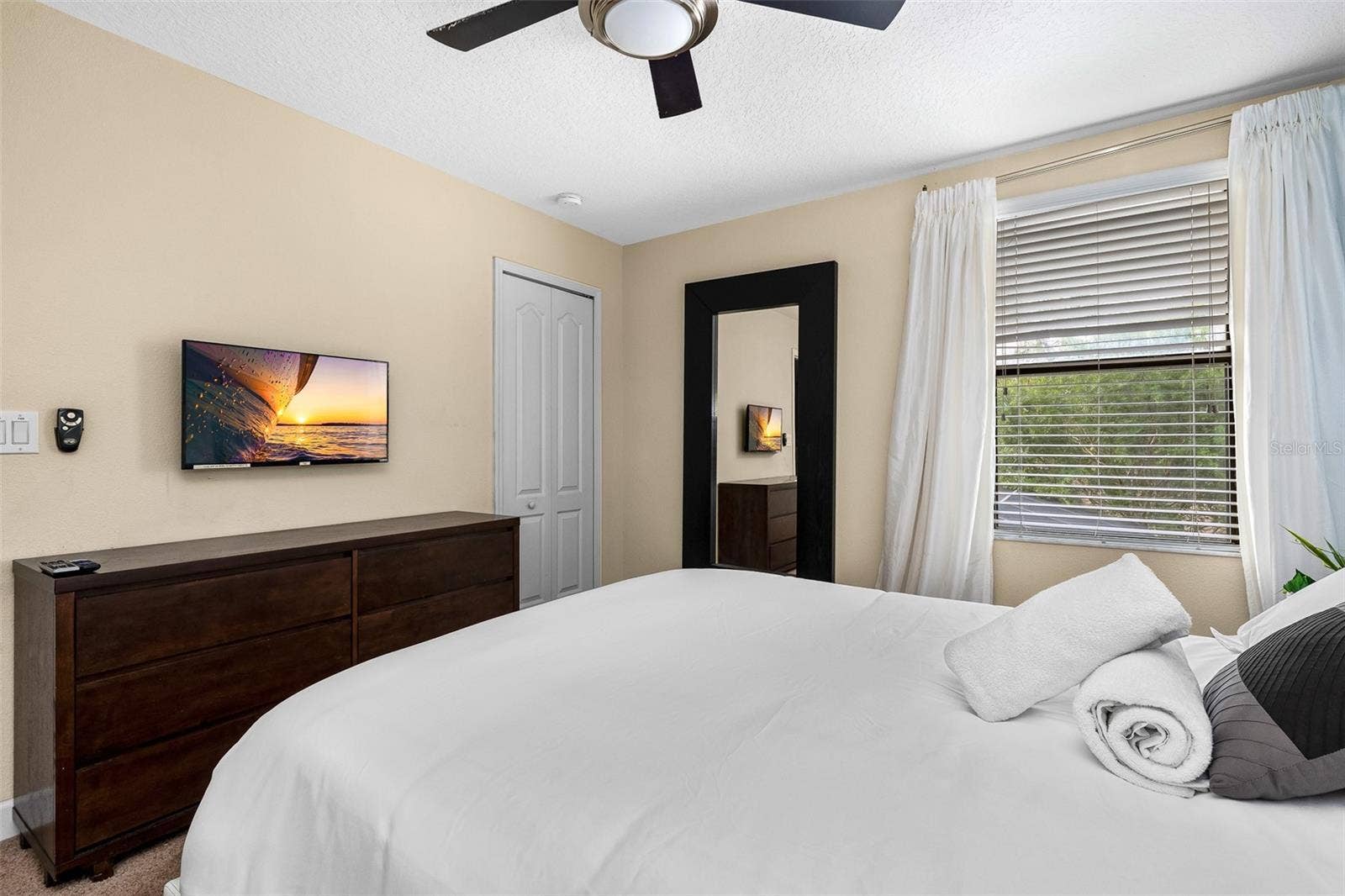 Additional View of the Queen Bedroom with Flat-Screen Television