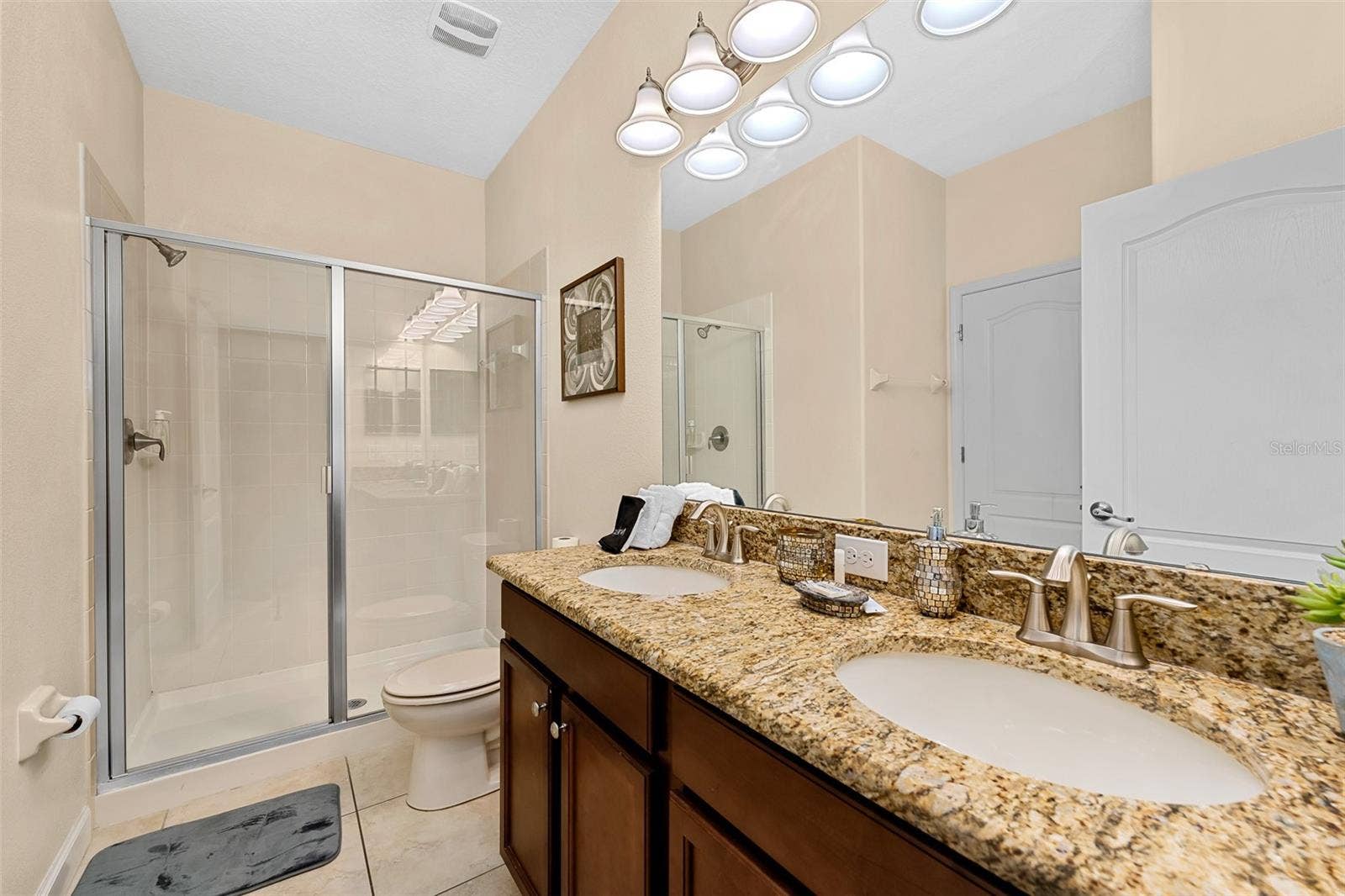 Full Bathroom with Granite Vanity and Tub/Shower Combination