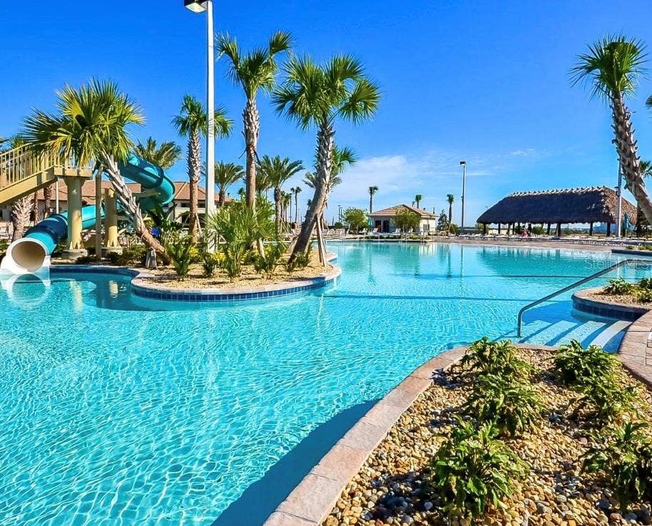 Enjoy the Oasis Club's Resort-Style Pools and Tropical Waterpark Setting