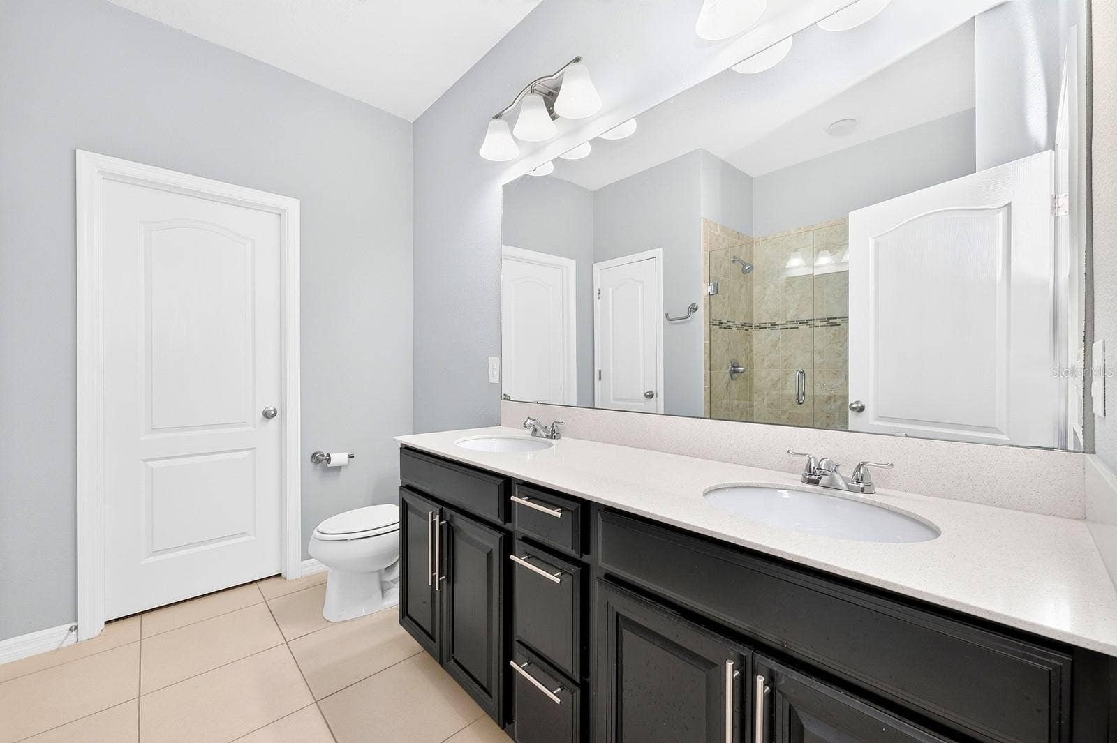 2128 LENNOX DALE LANE, Brandon, FL 33510 The Primary en suite Bath features a walk-in closet.