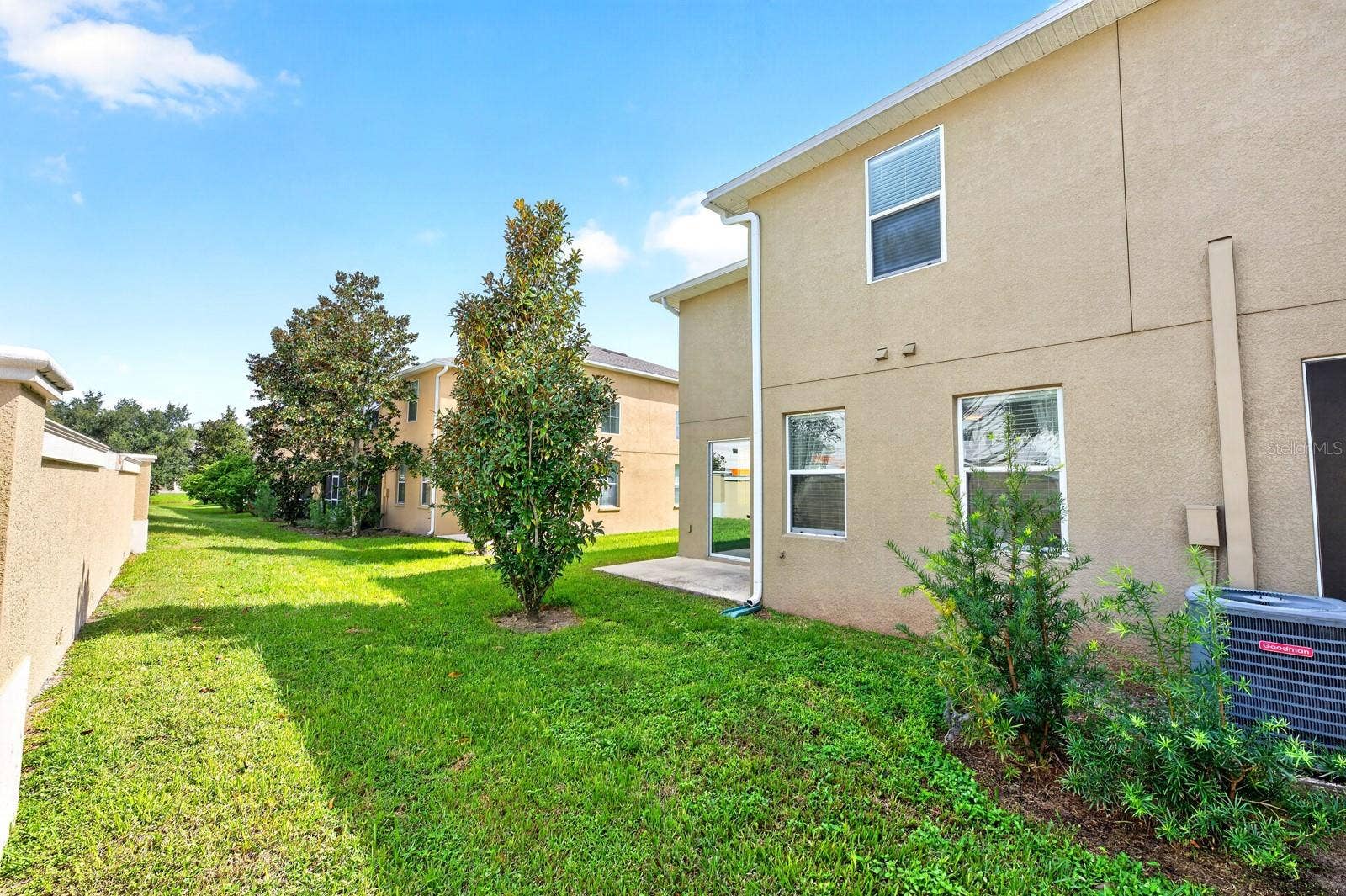 2128 LENNOX DALE LANE, Brandon, FL 33510 Sliding glass doors extend the living space outdoors to the back patio overlooking a peaceful GREEN SPACEa wonderful spot to enjoy your morning coffee or unwind at the end of the day.