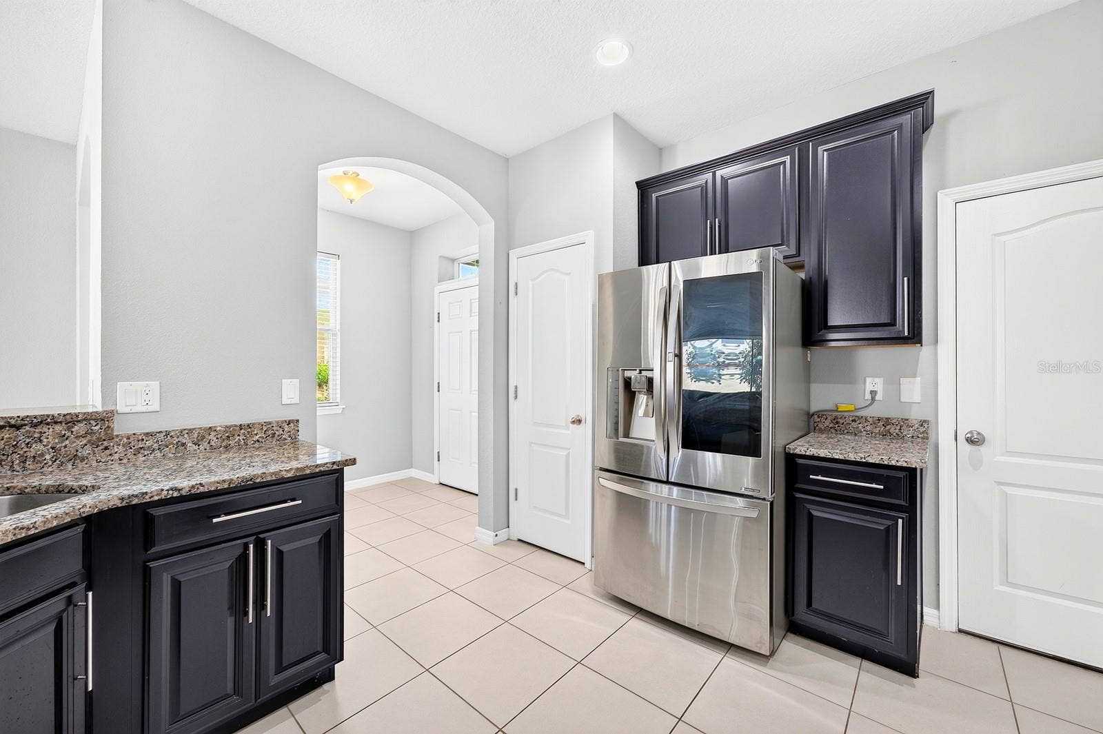 2128 LENNOX DALE LANE, Brandon, FL 33510 A closet pantry offers convenient storage, while the BREAKFAST BAR provides a natural place for casual meals, conversation or keeping the cook company.