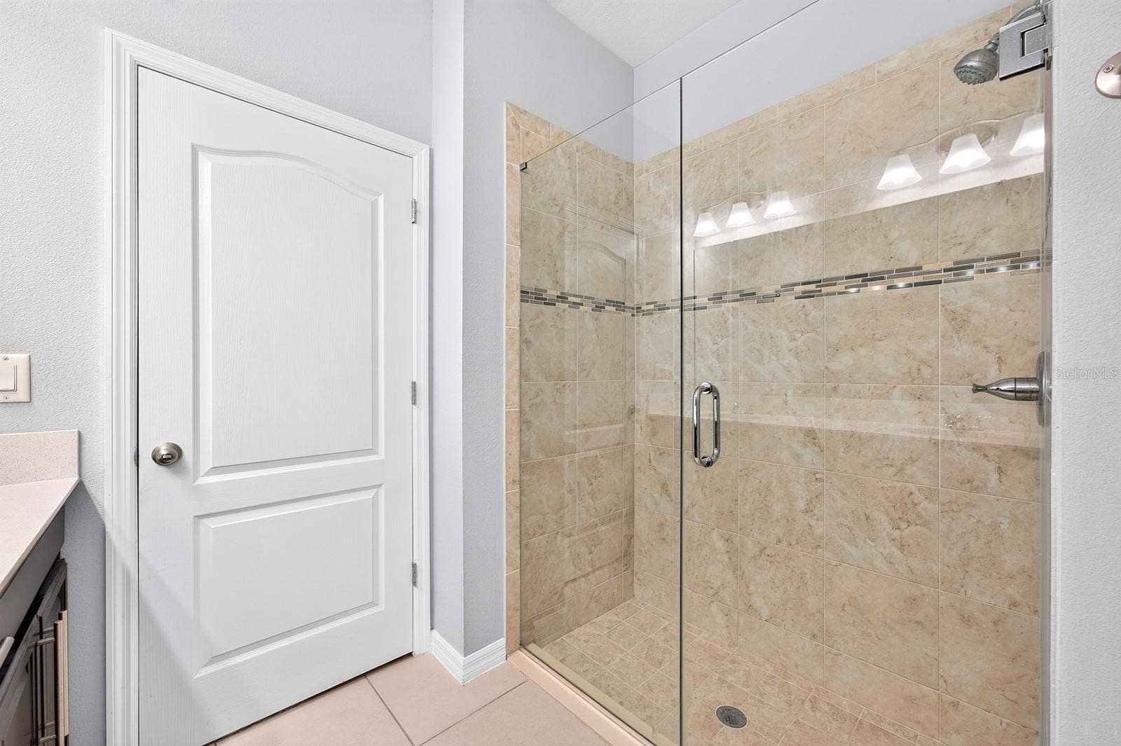 2128 LENNOX DALE LANE, Brandon, FL 33510 The private Bath features dual sinks, a STEP-IN SHOWER and a linen closet for additional storage.