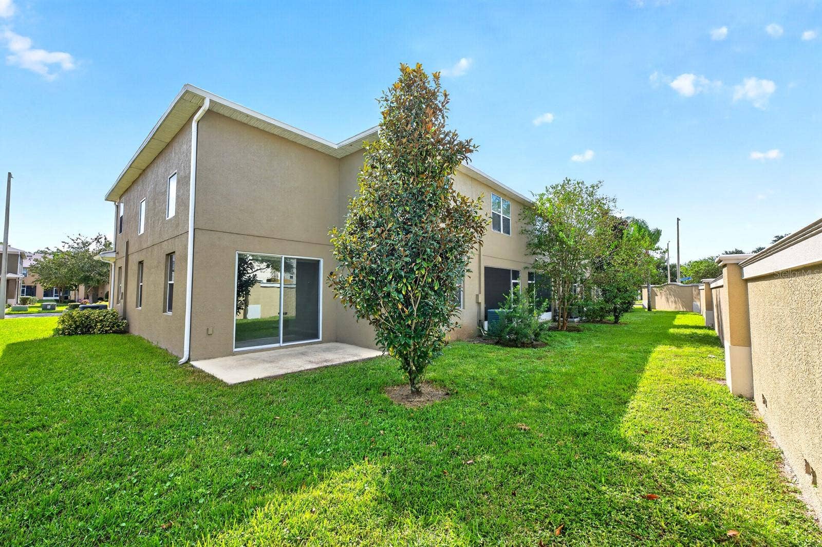 2128 LENNOX DALE LANE, Brandon, FL 33510 Sliding glass doors extend the living space outdoors to the back patio overlooking a peaceful GREEN SPACEa wonderful spot to enjoy your morning coffee or unwind at the end of the day.