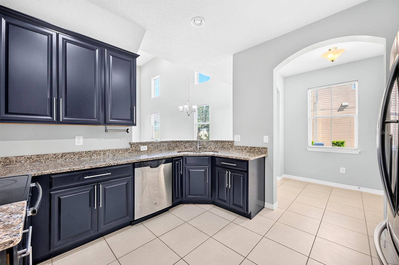 2128 LENNOX DALE LANE, Brandon, FL 33510 The Kitchen is both beautiful and functional, featuring 42-INCH CABINETRY, GRANITE COUNTERTOPS AND STAINLESS STEEL APPLIANCES.