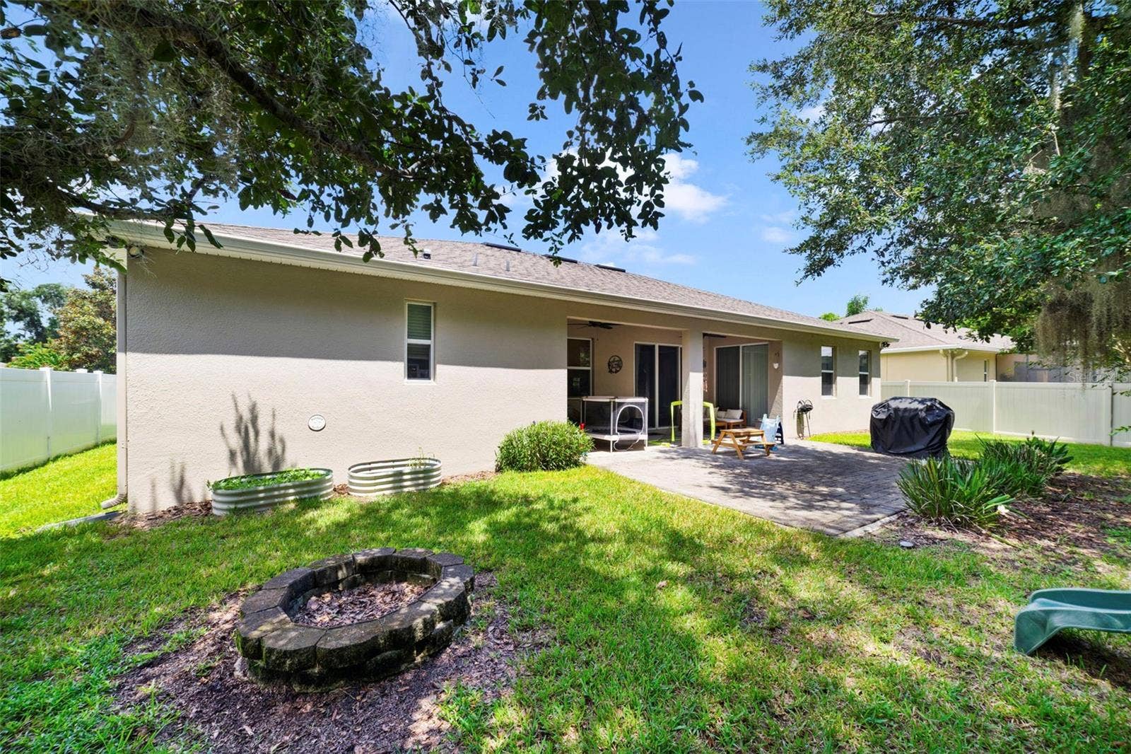 611 MEADOW SAGE DRIVE, Deland, FL 32724 Covered lanai overlooks the backyard.