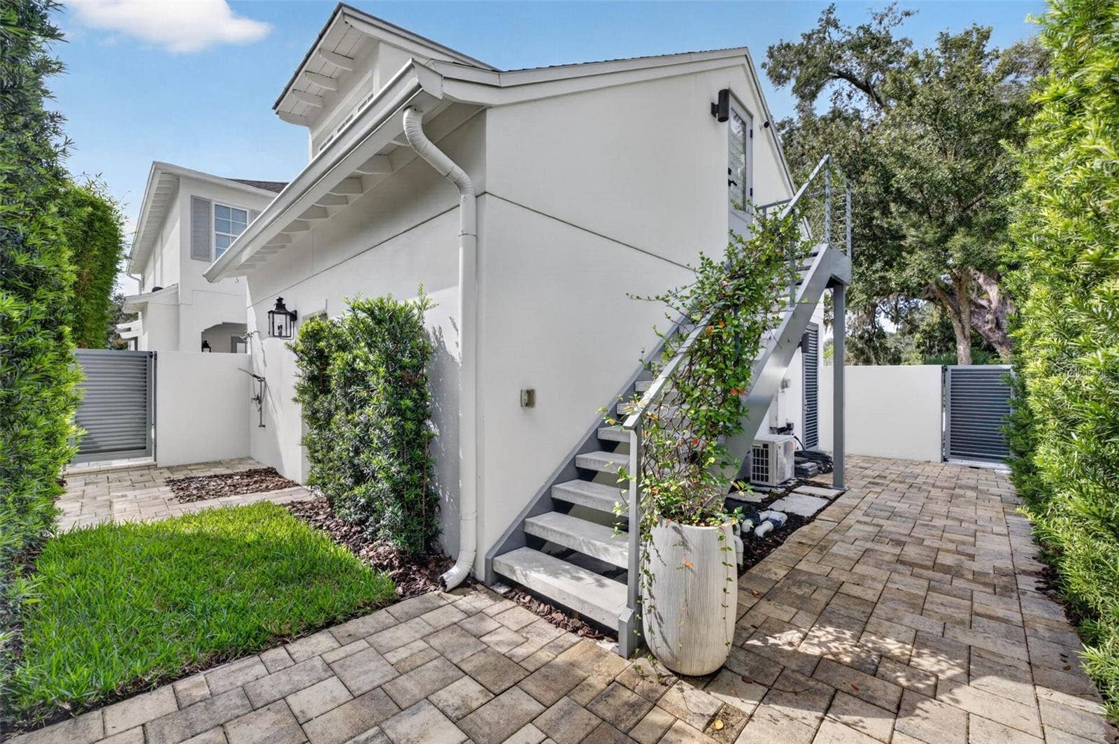 1900 SUNSET DRIVE, Winter Park, FL 32789 Outdoor shower and upgraded concrete stairs with powder-coated aluminum railings
