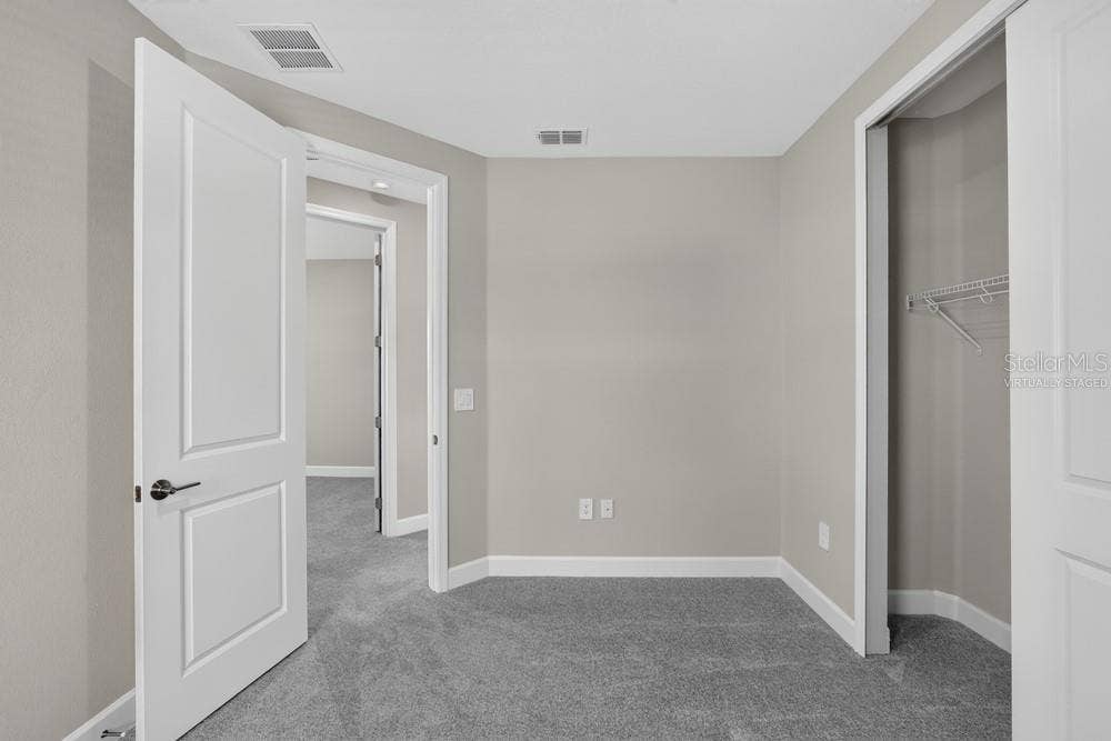 5691 SEAGRAPE LANE, Kissimmee, FL 34758 Virtually staged photos are for representative purposes only.