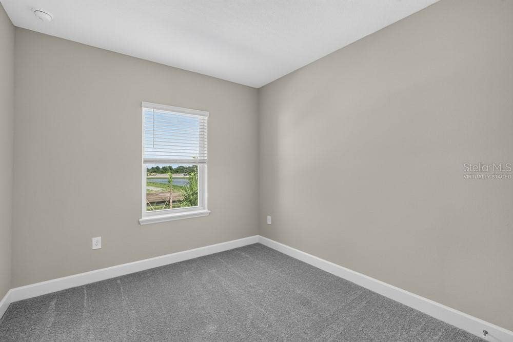 5691 SEAGRAPE LANE, Kissimmee, FL 34758 Virtually staged photos are for representative purposes only.