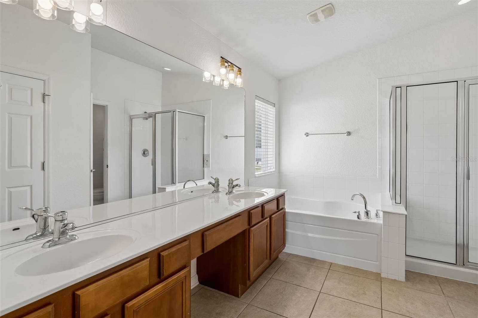 2956 SANTA MARIA AVENUE, Clermont, FL 34715 Primary bath with dual sinks