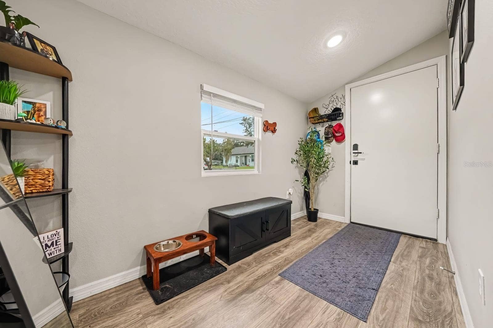 1611 SALMON STREET, St Cloud, FL 34771 Bright mudroom entry with hardwood floors and storage shelving