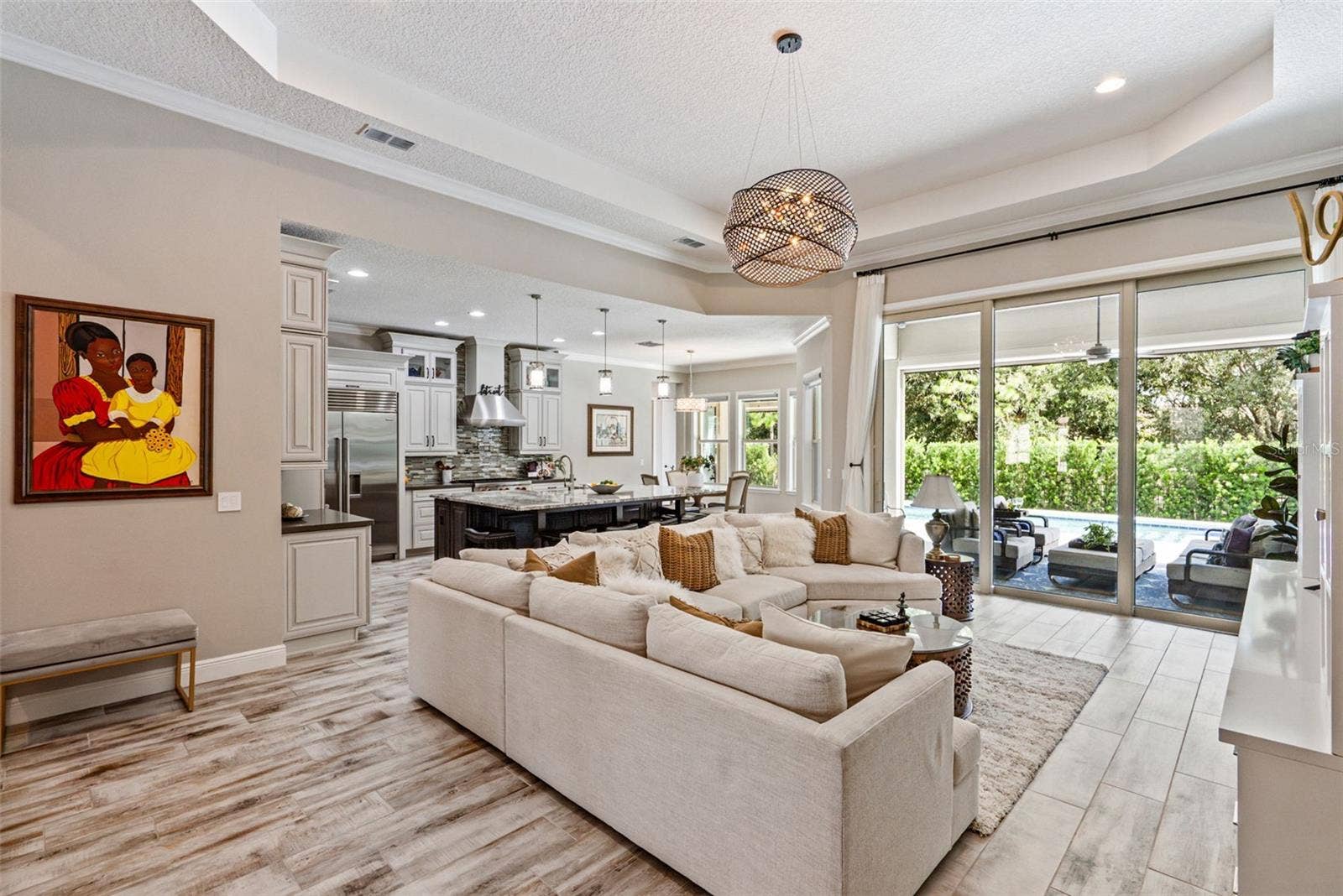 Open layout living room w/ soaring 13-ft ceilings and indoor/outdoor Florida living room