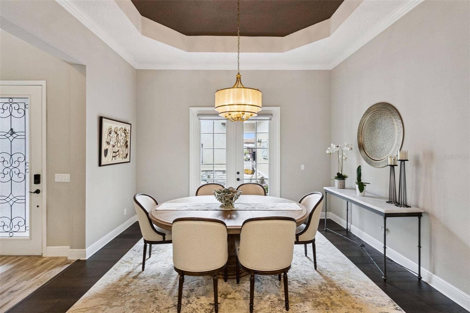 Formal dining room w/ French doors to courtyard