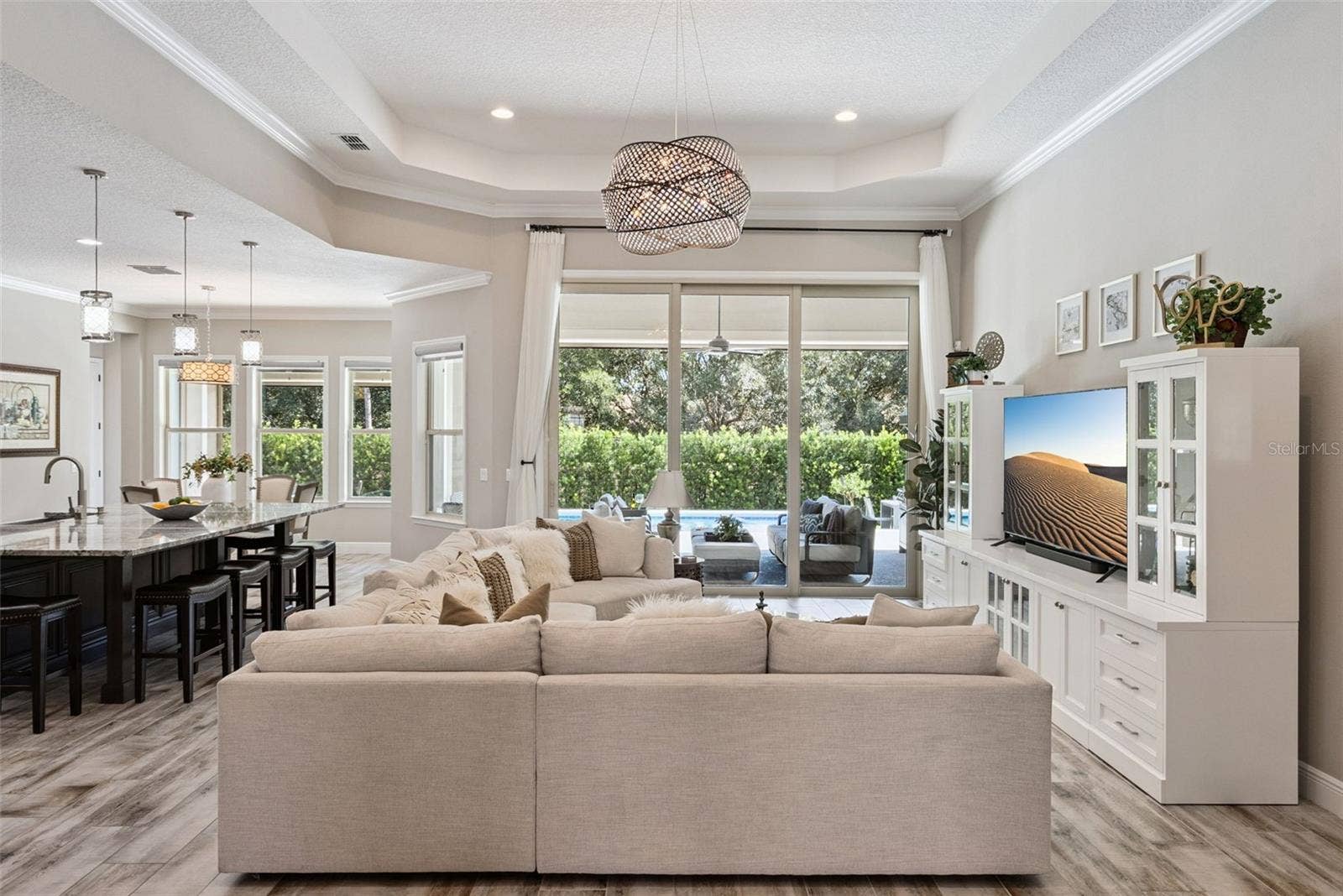 Open layout living room w/ soaring 13-ft ceilings and indoor/outdoor Florida living room
