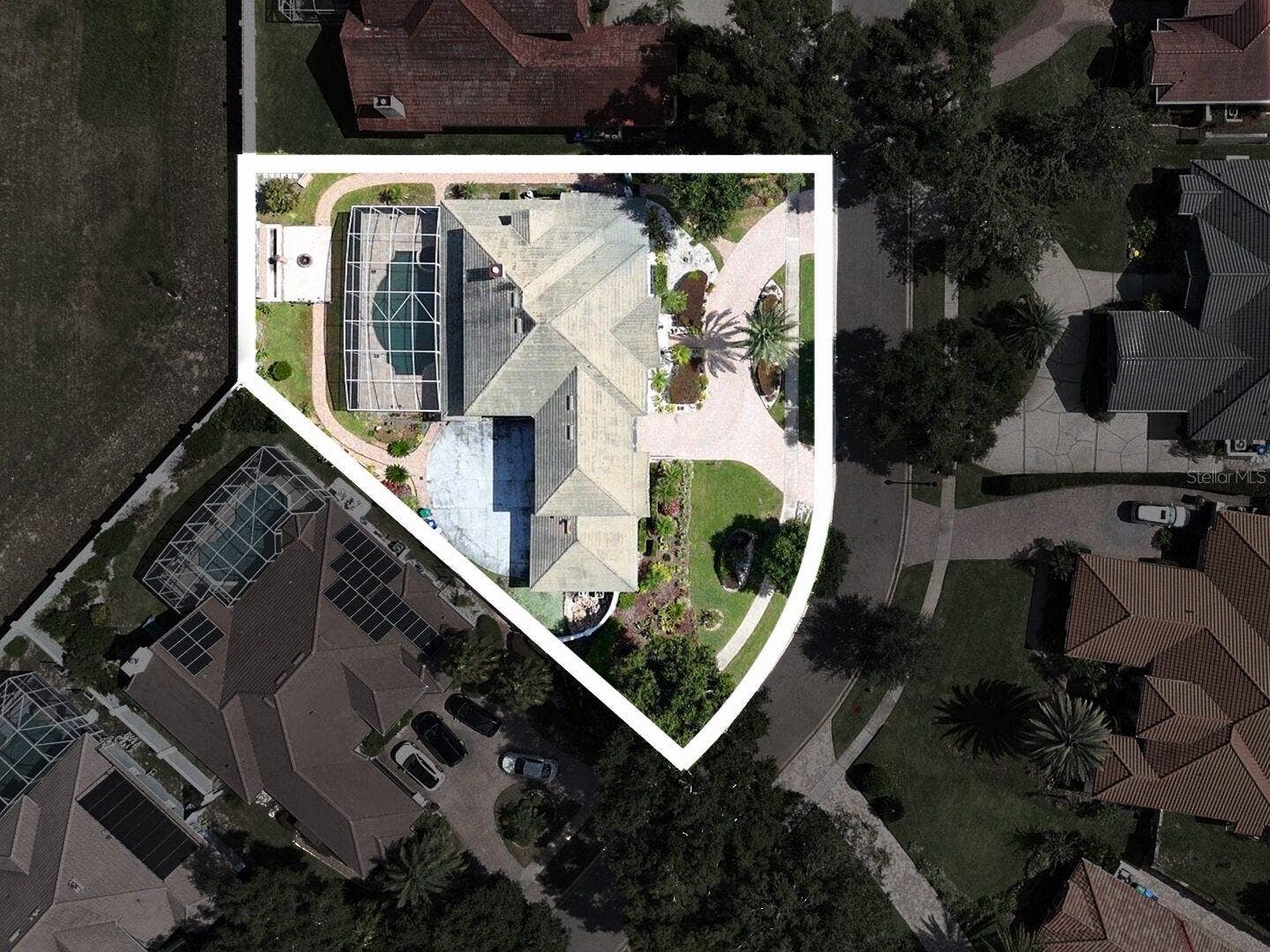Aerial view of the home and pool