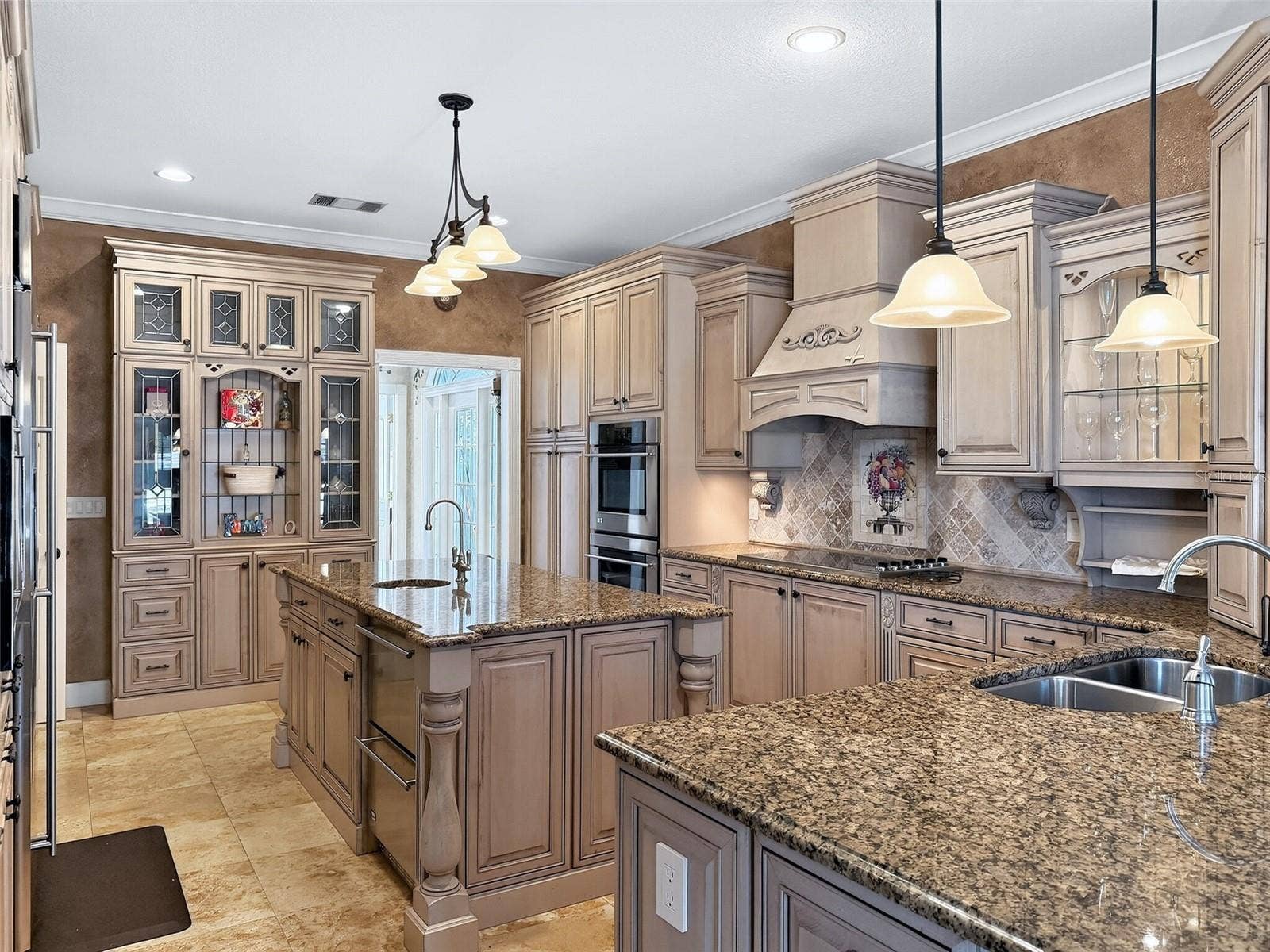 Chef's kitchen with custom cabinetry and granite