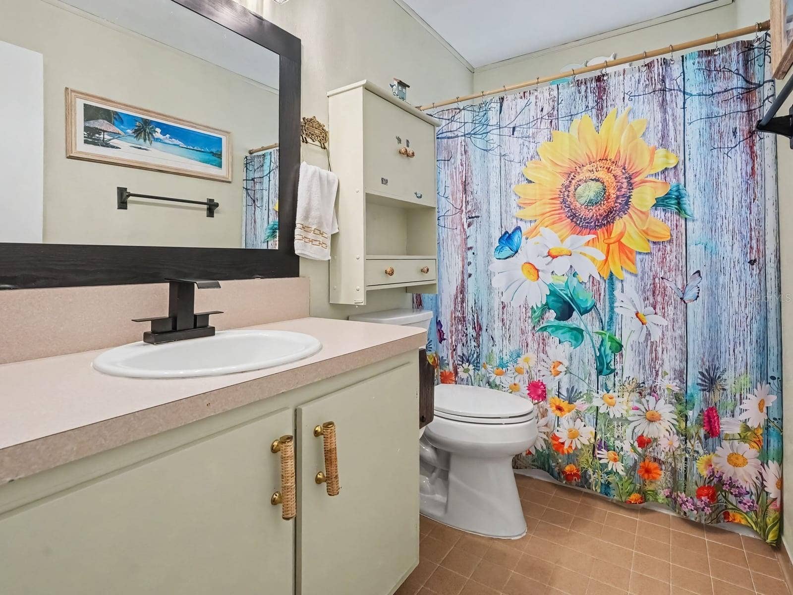 Master Bath with Floral Shower Curtain and Vanity Sink