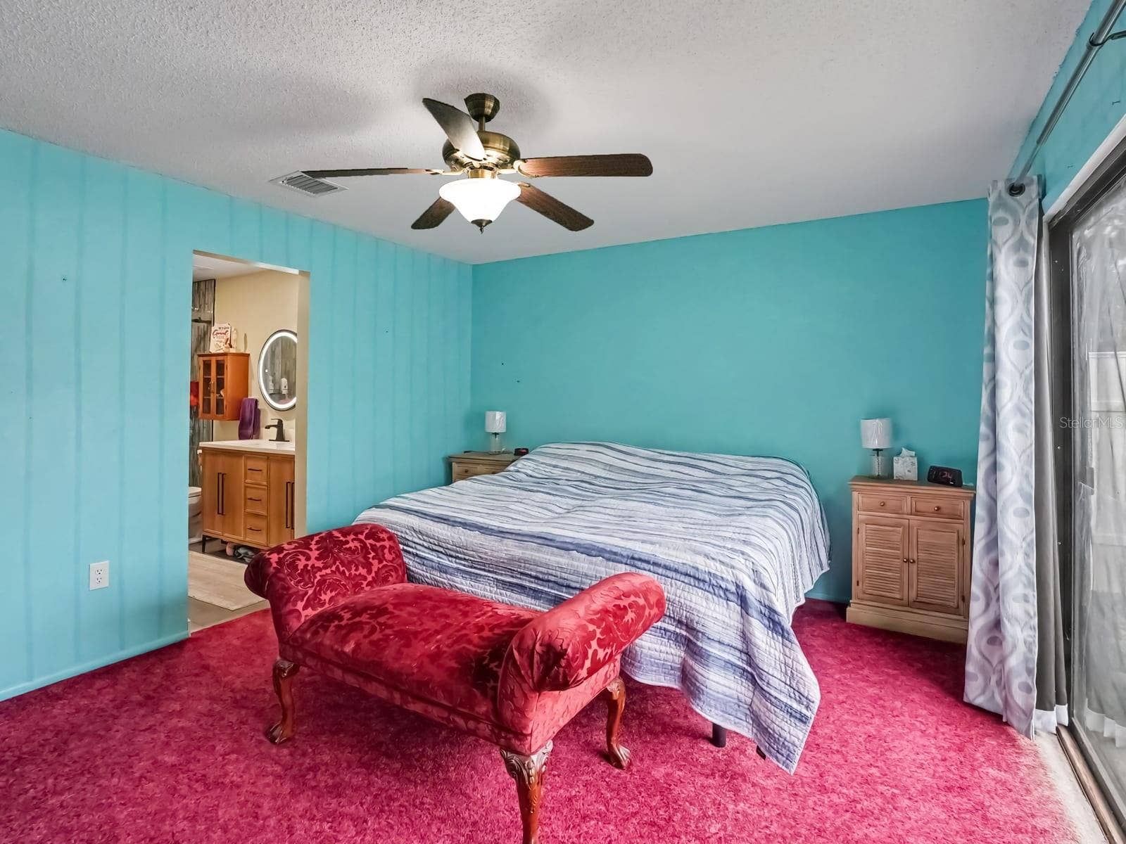 Master Bedroom with Turquoise Walls & Ensuite Bath Access