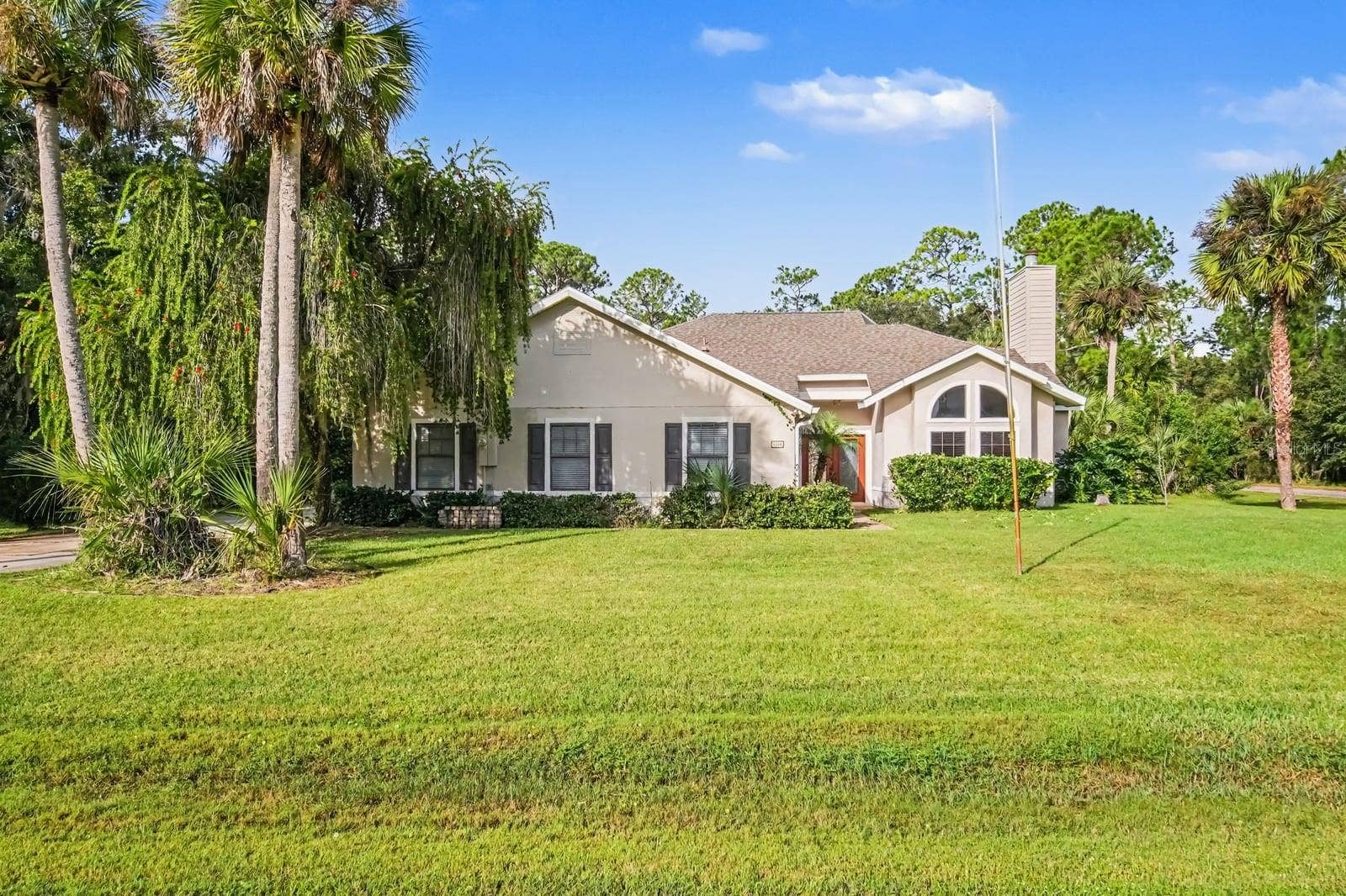 5560 BOB WHITE TRAIL, Mims, FL 32754 Spacious home on lush grounds with mature palms and manicured lawn