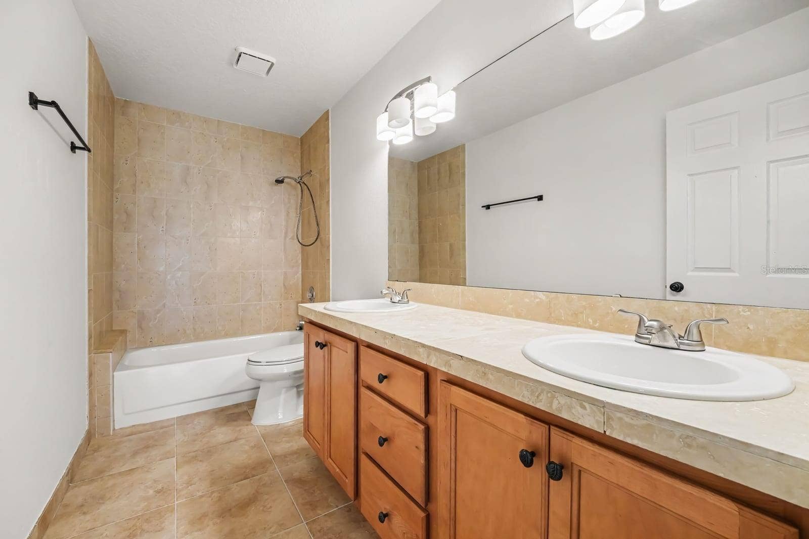 5560 BOB WHITE TRAIL, Mims, FL 32754 Master Bath Featuring Dual Vanities, Soaking Tub, and Tiled Shower