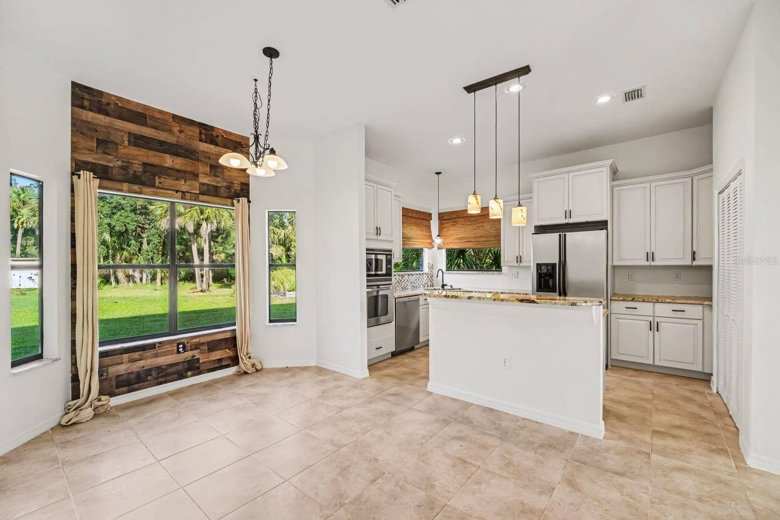 5560 BOB WHITE TRAIL, Mims, FL 32754 Open Kitchen & Family Room With Granite Counters, Stainless Appliances & Panoramic Views