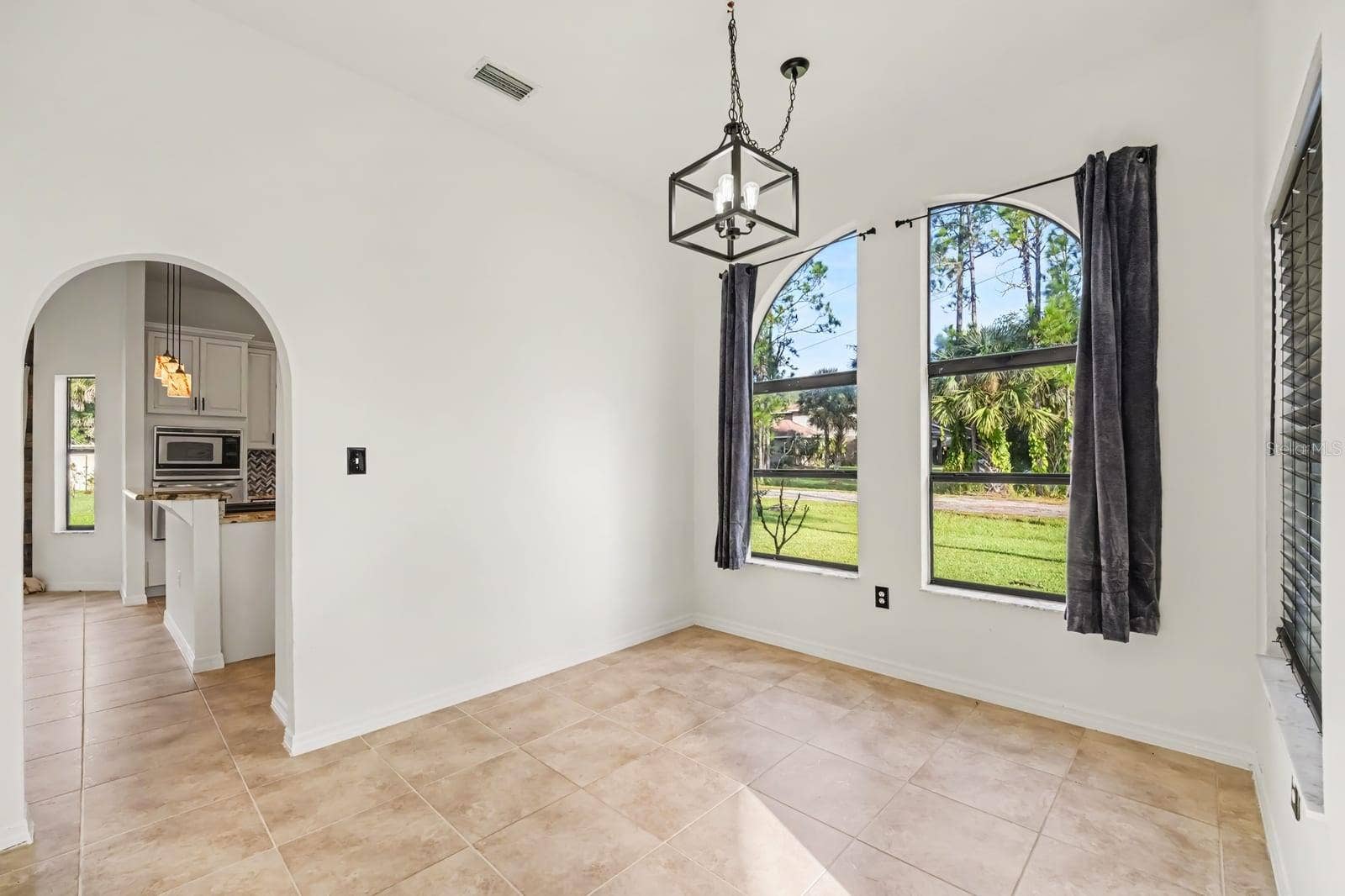 5560 BOB WHITE TRAIL, Mims, FL 32754 Bright Bedroom With Large Windows, Pendant Lighting & Direct Patio Access