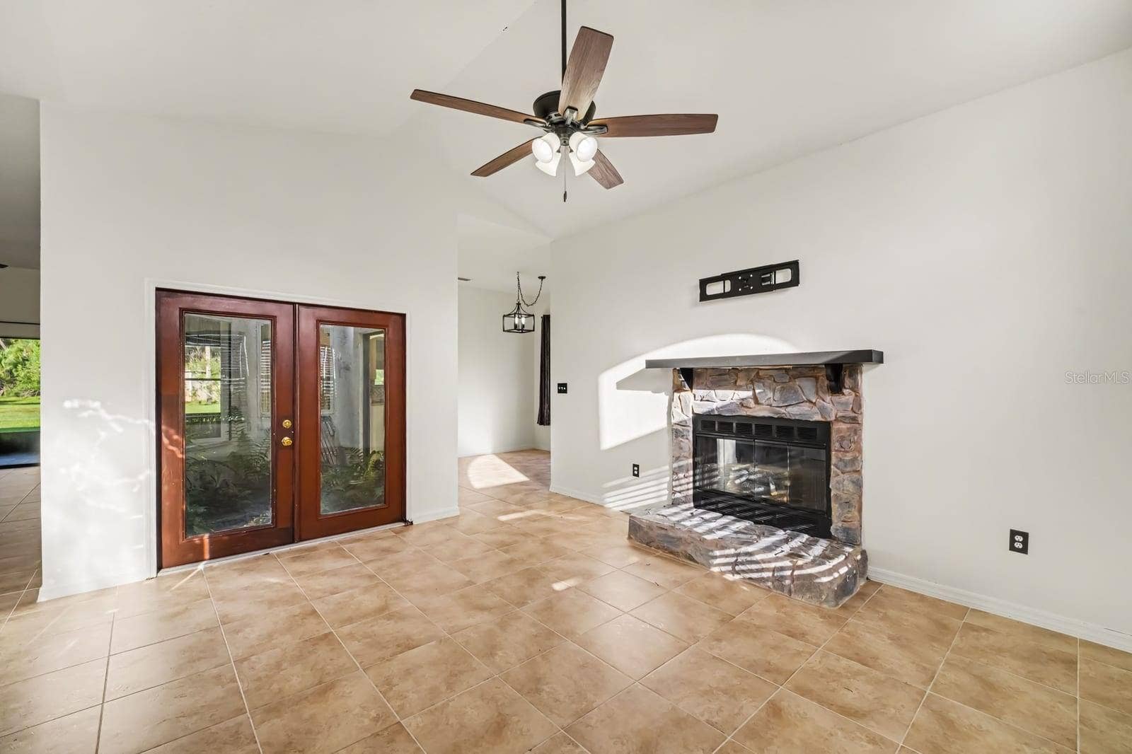 5560 BOB WHITE TRAIL, Mims, FL 32754 Fireplace focal point with soaring ceilings and abundant natural light