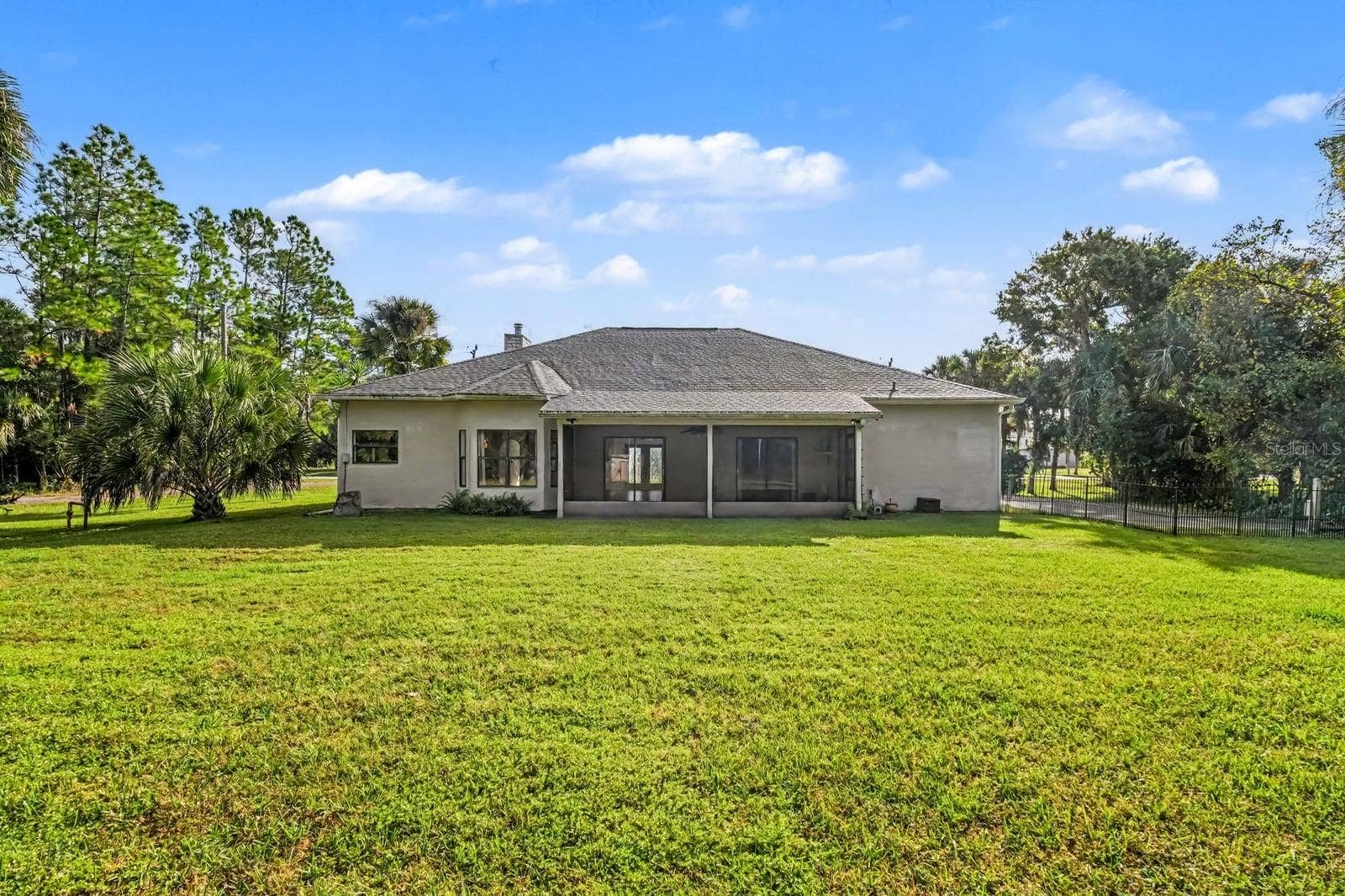 5560 BOB WHITE TRAIL, Mims, FL 32754 Rear Elevation Showing One-Story Home on Large Manicured Property