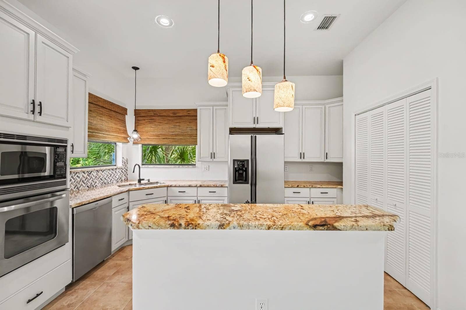 5560 BOB WHITE TRAIL, Mims, FL 32754 Modern Kitchen With Large Island, Glass Pendant Lights & Herringbone Backsplash