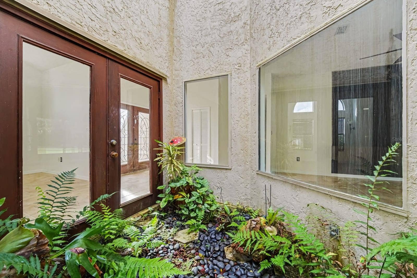 5560 BOB WHITE TRAIL, Mims, FL 32754 Covered Patio With Stuccoed Exterior and Glass Doors