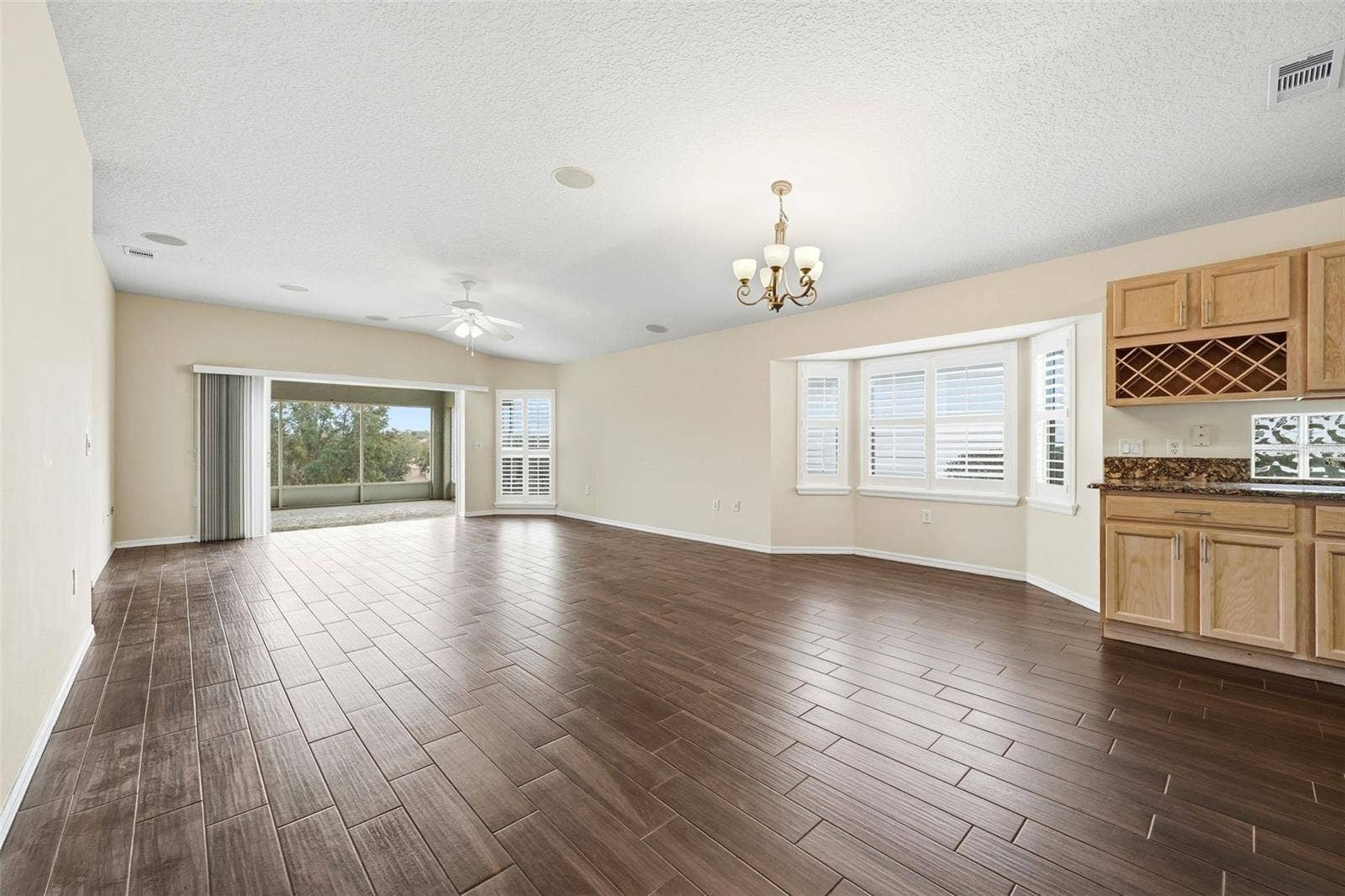 2311 N ANDREA POINT, Lecanto, FL 34461 Dining area with bay windows...plantation shutters...kitchen built-in wine rack!