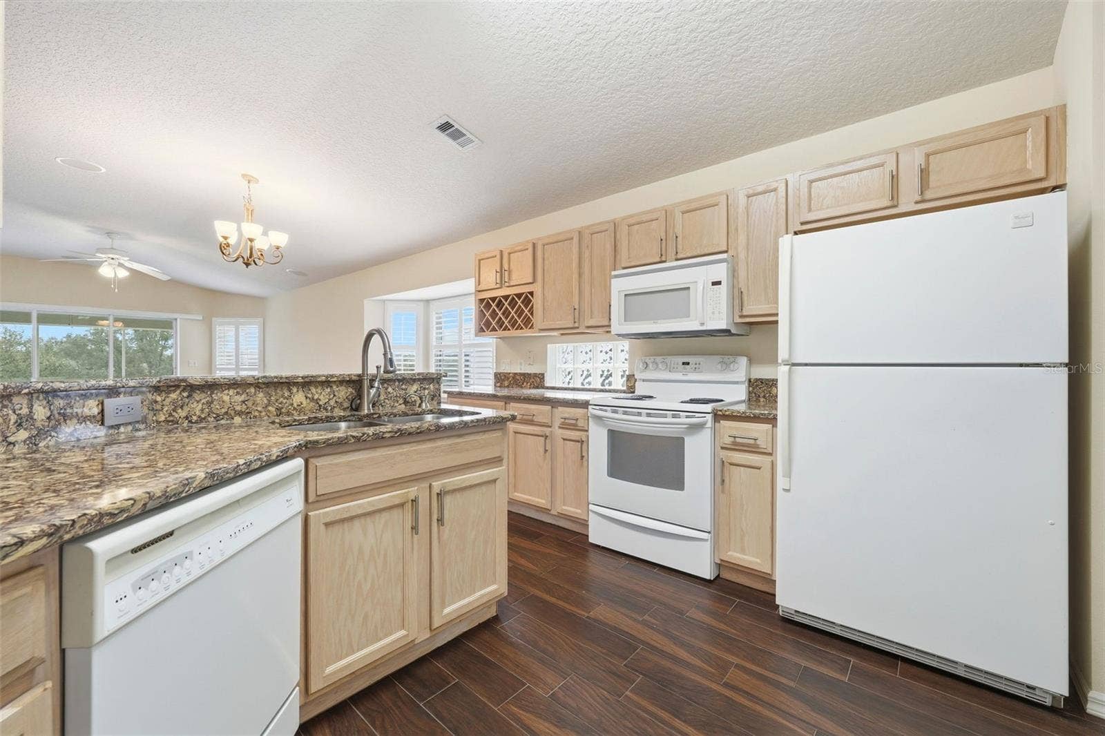 2311 N ANDREA POINT, Lecanto, FL 34461 Plenty of cabinet space, Solid Surface Countertops, built-in wine rack and open to great room and golf course view!