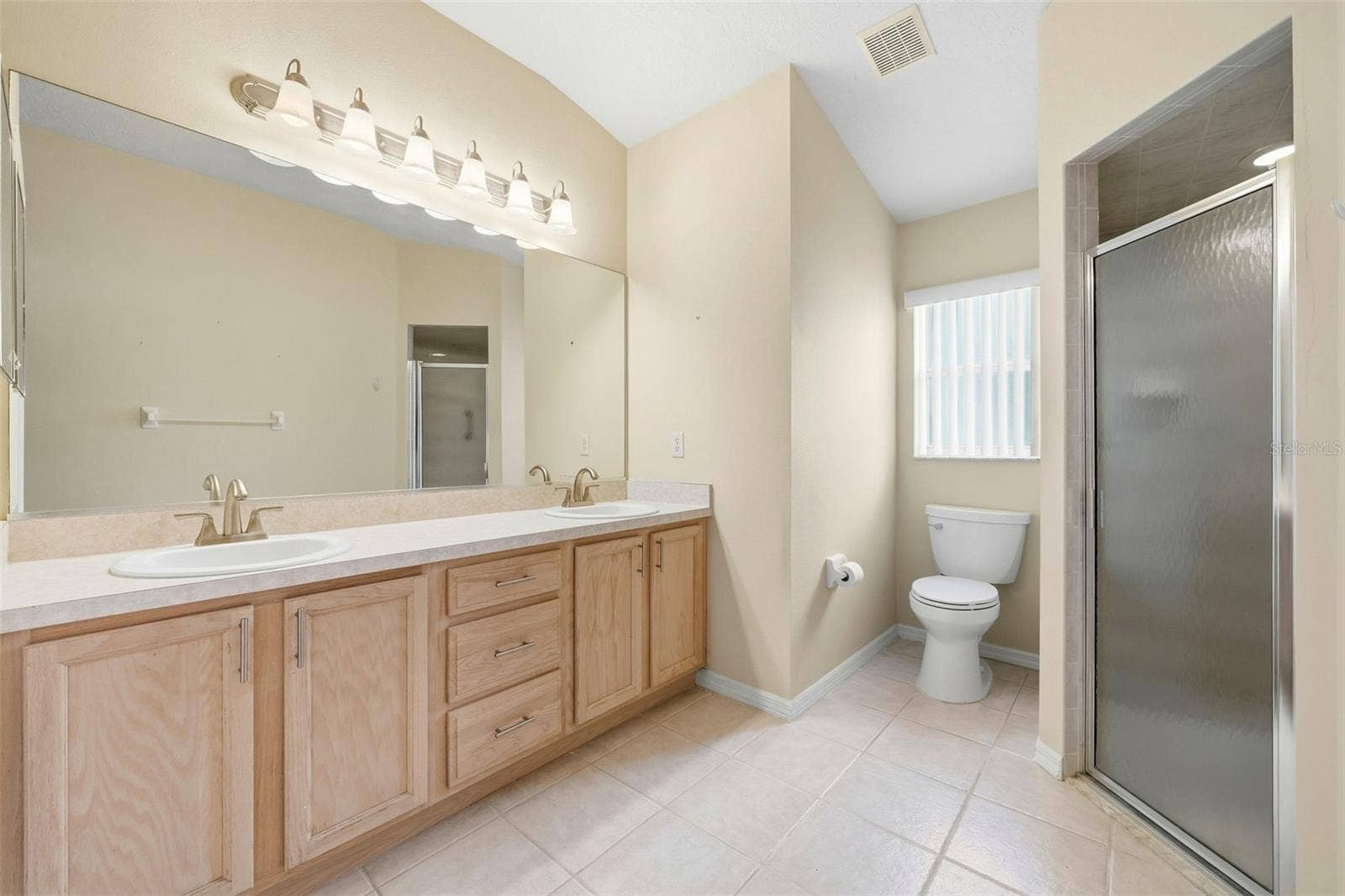 2311 N ANDREA POINT, Lecanto, FL 34461 Primary Bathroom with dual sinks, linen and shower