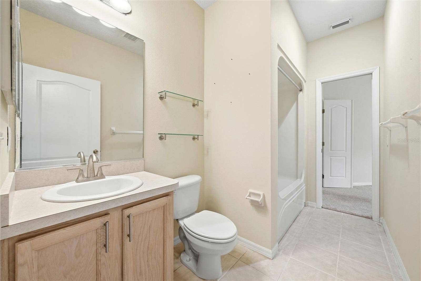 2311 N ANDREA POINT, Lecanto, FL 34461 Guest Bath with tub/shower combination and one door to hallway next to Bedroom 2 and one door to office/den or possibly third bedroom suite
