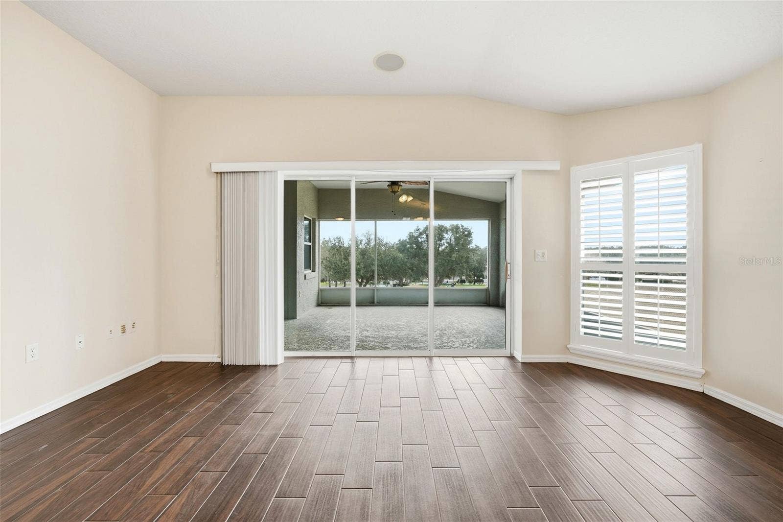 2311 N ANDREA POINT, Lecanto, FL 34461 Great Room with plantation shutters and pocket triple sliding doors to lanai with golf course view!