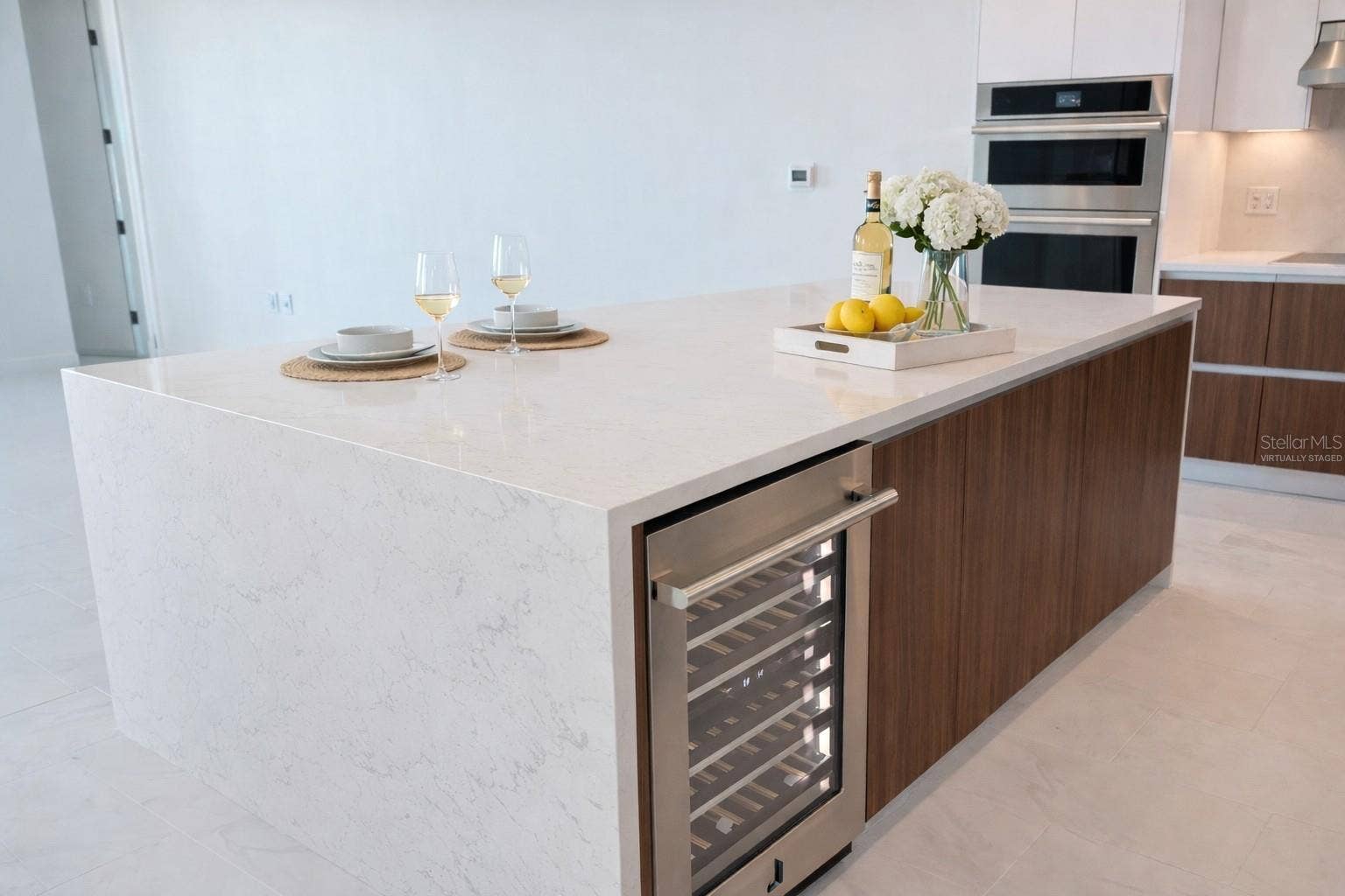 400 CENTRAL AVENUE, #2603, St Petersburg, FL 33701 Waterfall Quartz Island / Breakfast Bar / Kitchen with Stainless Steel Jenn Beverage / Wine Fridge - Virtually Staged