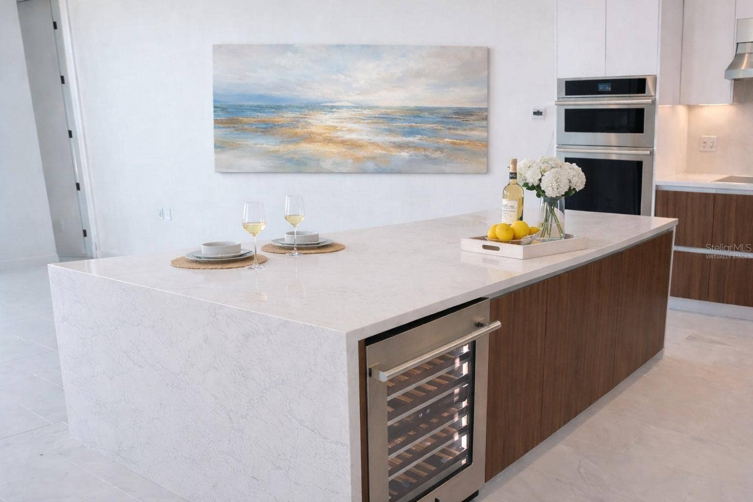 400 CENTRAL AVENUE, #2603, St Petersburg, FL 33701 Waterfall Quartz Island / Breakfast Bar / Kitchen with Stainless Steel Jenn Beverage / Wine Fridge - Virtually Staged