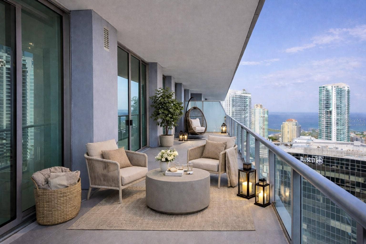 400 CENTRAL AVENUE, #2603, St Petersburg, FL 33701 Gorgeous 52' (Length) Balcony with Access from Living Room, Owners Bedroom and 2 Guest Bedrooms Overlooking Tampa Bay, Gulf of Mexico and City - Virtually Staged