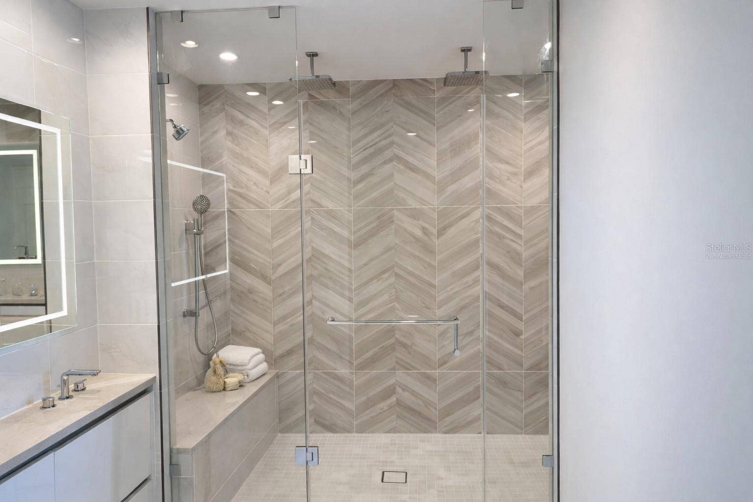 400 CENTRAL AVENUE, #2603, St Petersburg, FL 33701 Owner Bathroom Large Frameless Glass Shower with 2 Rain Heads / 2 Additional Shower Heads and 2 Tiled Benches - Virtually Staged