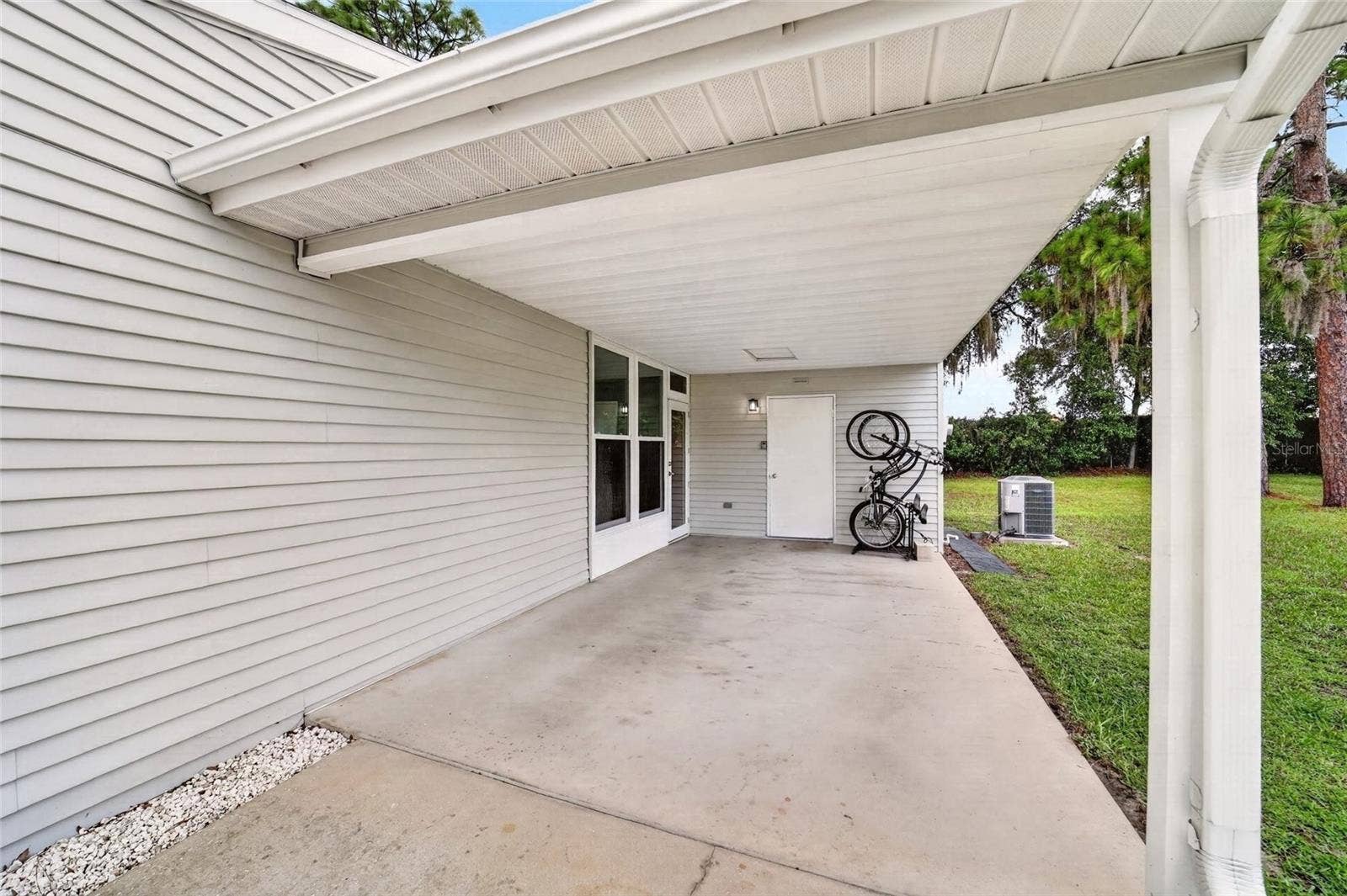 9282 SW 109TH LANE, Ocala, FL 34481 Carport and Driveway Parking and attached shed for more STORAGE